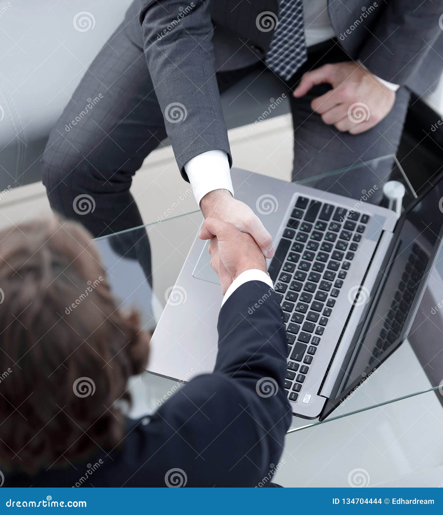Handshake of Business Partners Above the Desk. Stock Photo Image of