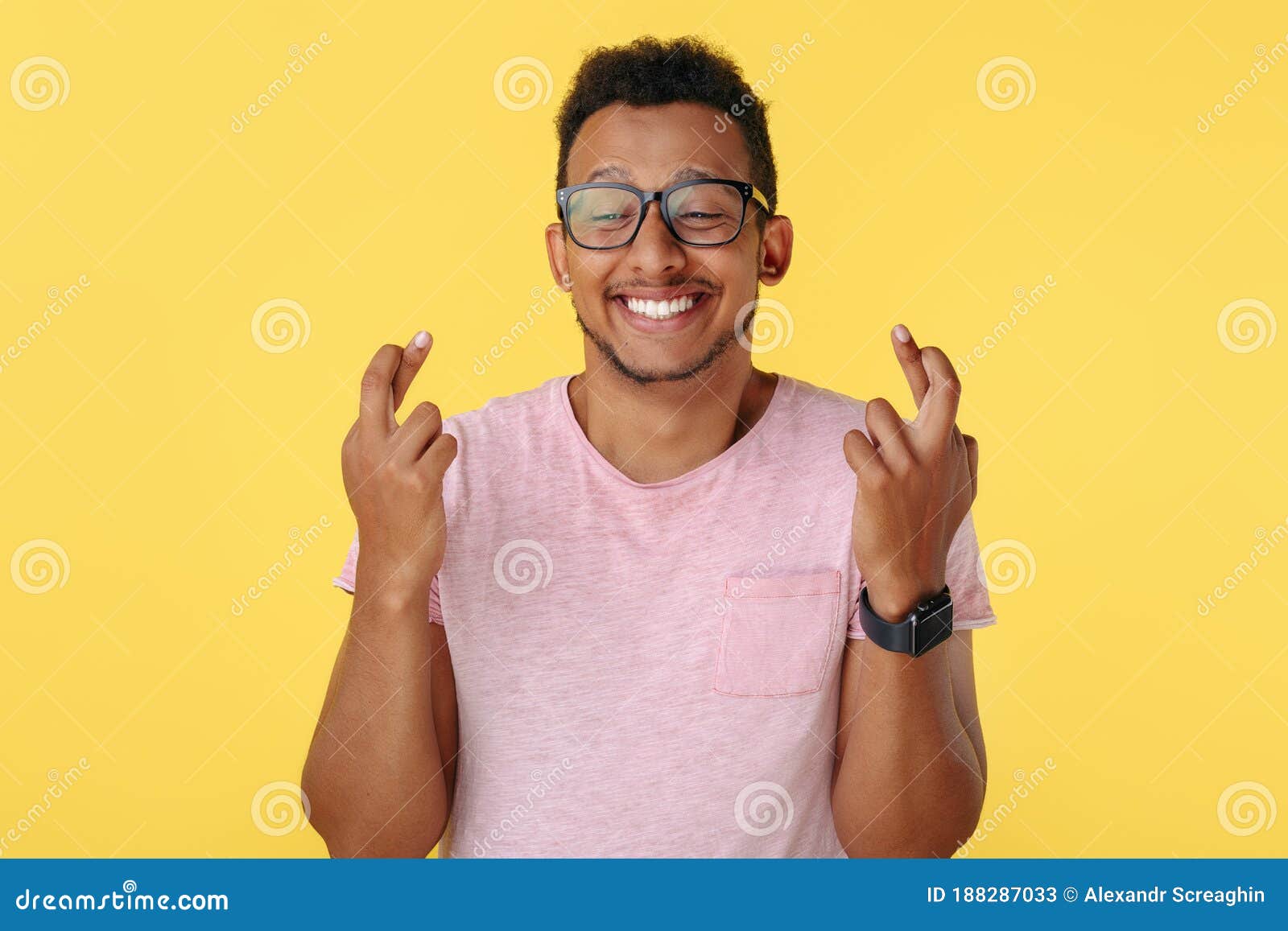 Handsome African American Young Man Holding Fingers Crossed in Hope ...