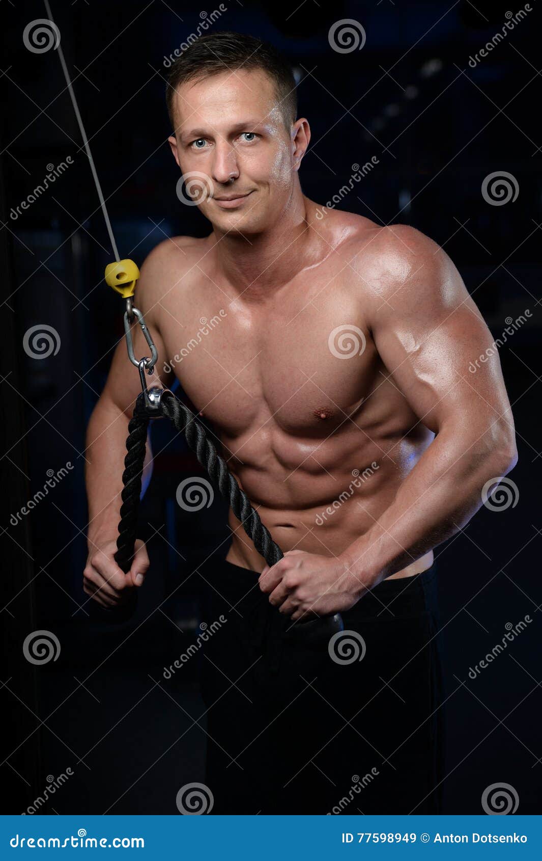 Handsome Athletic Fitness Man Posing And Trains In The Gym Stock Image