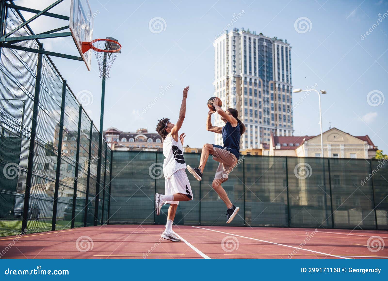 Guys playing basketball stock photo. Image of cityscape - 299171168