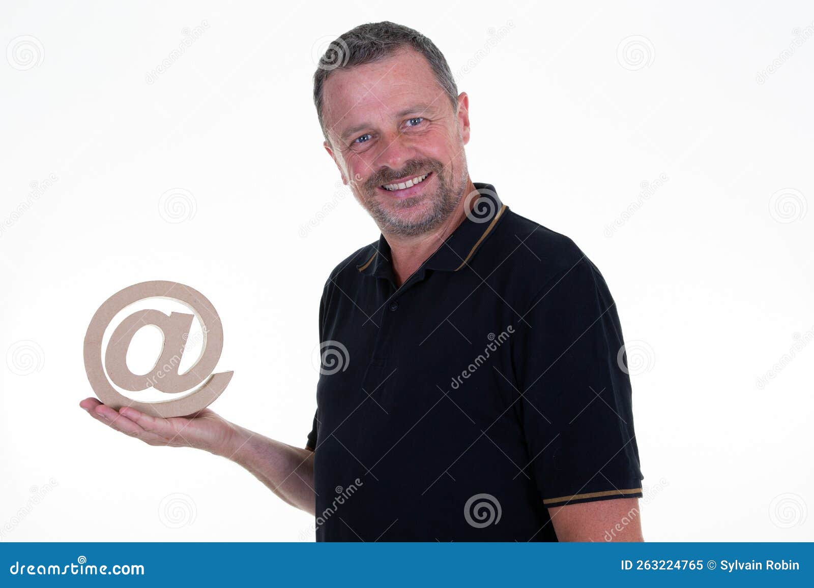 handsome beard man in black shirt holding email at arrobas  on white background