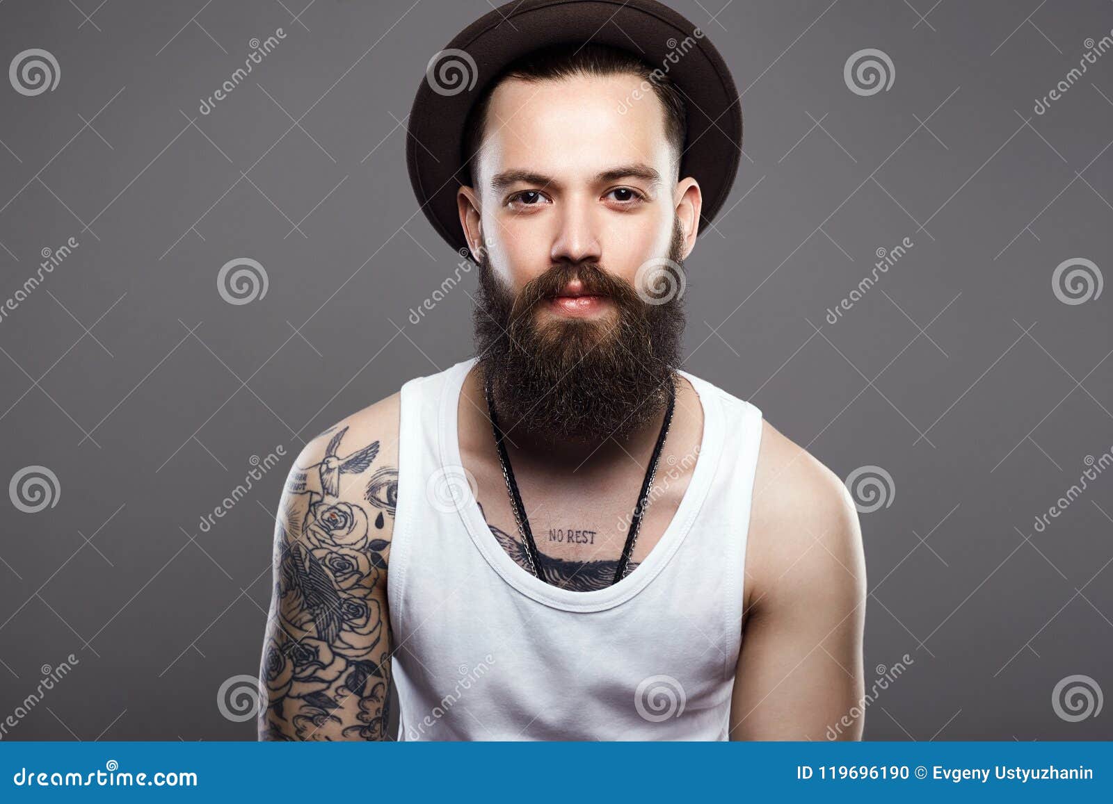 Handsome Bearded Man in Hat. Tattoo on the Hand Stock Photo - Image of ...