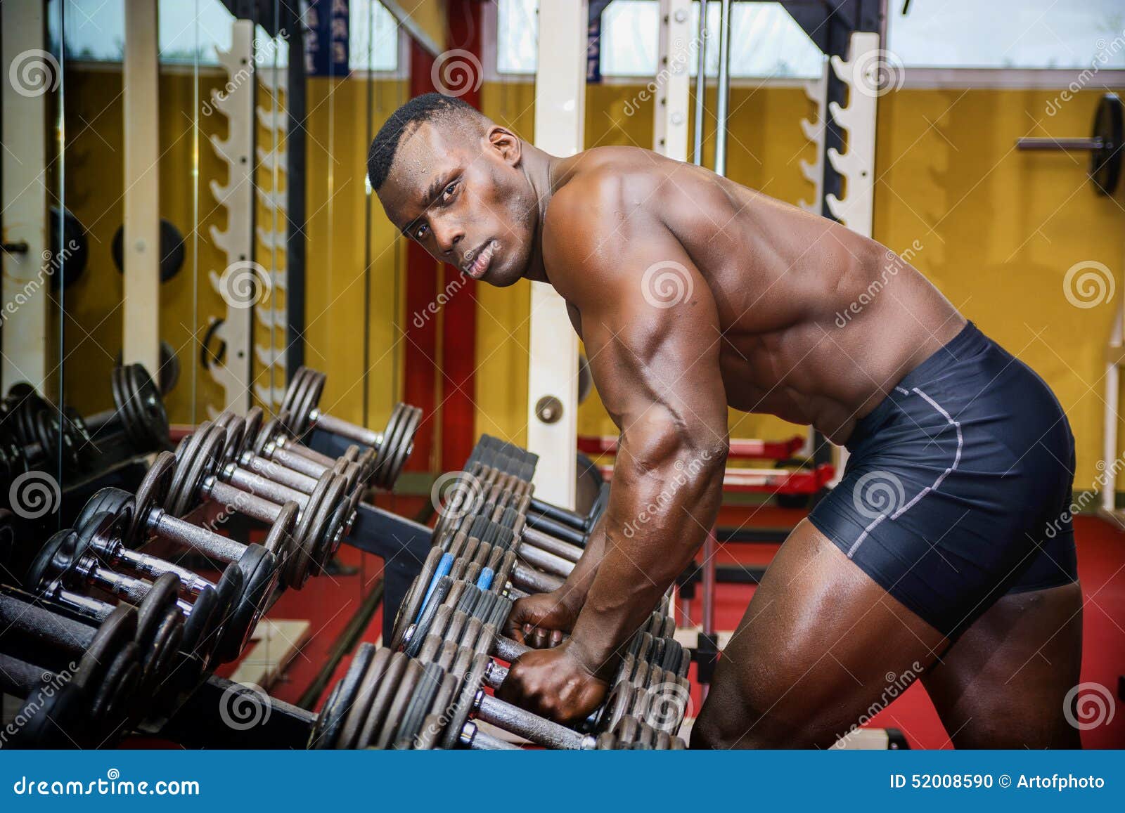 Handsome Black Male Bodybuilder Resting after Workout in Gym Stock