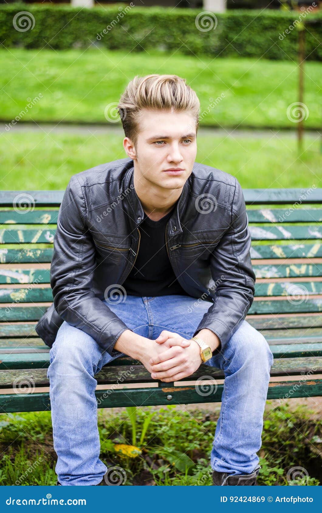 Handsome Blond Young Man Sitting on Park Bench Stock Image - Image of ...