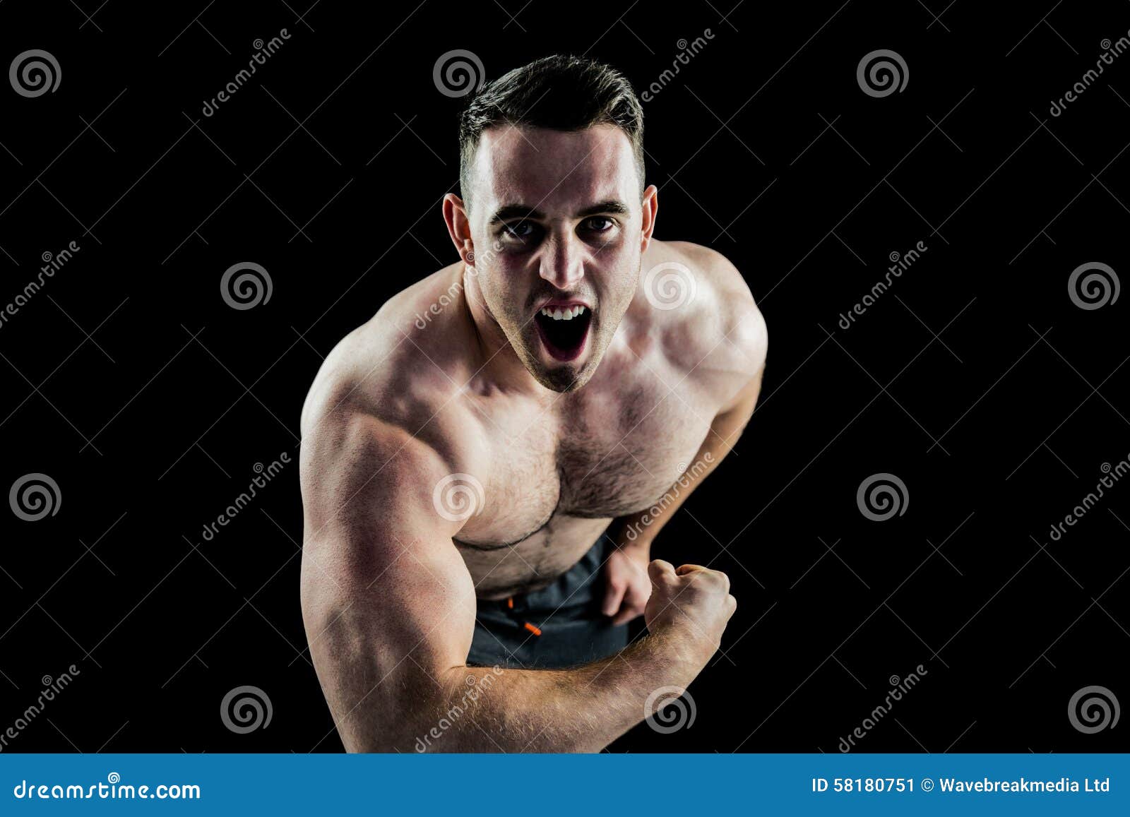 Handsome Muscular Bodybuilder Man Doing Exercises In Gym 