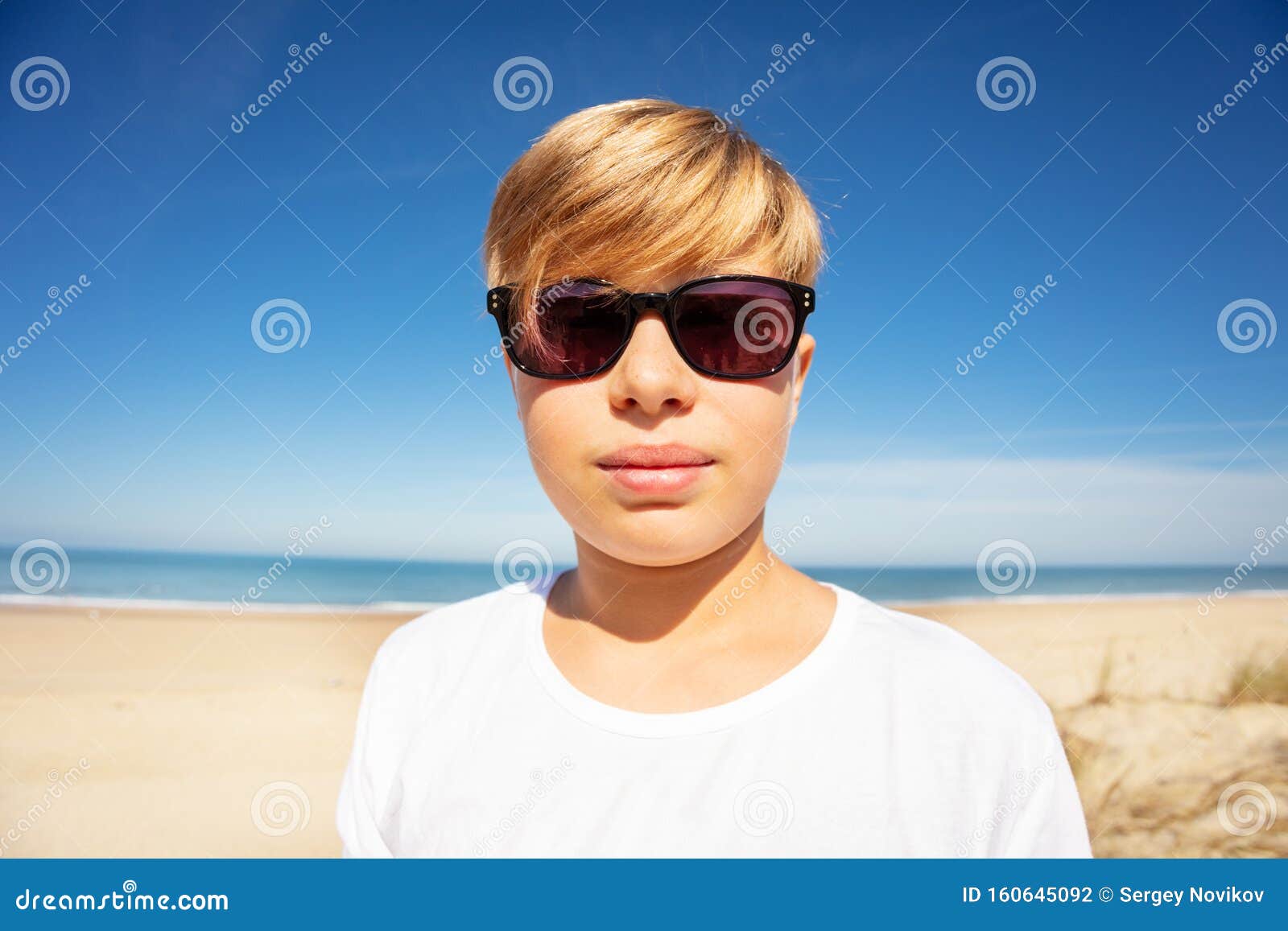 Handsome Boy in Sunglasses Close Portrait on Beach Stock Photo Image
