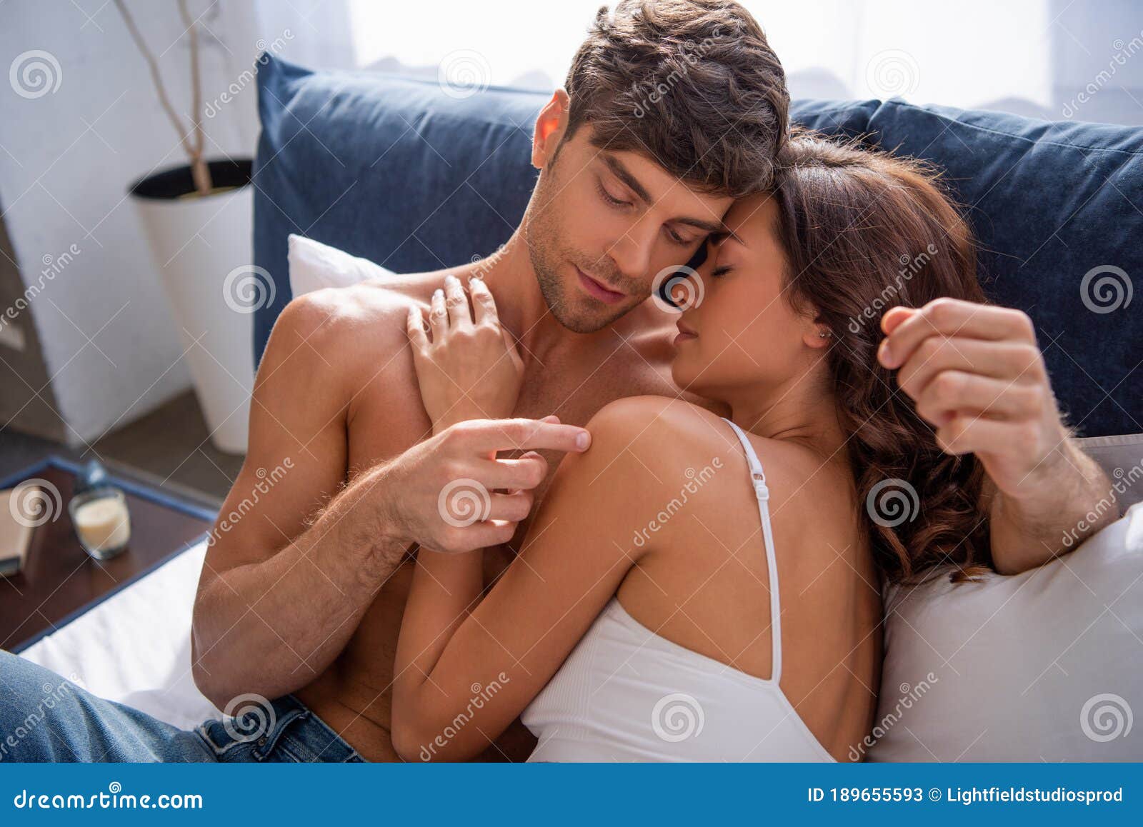 Girlfriend bra kissing hugging boyfriend apartment — stock