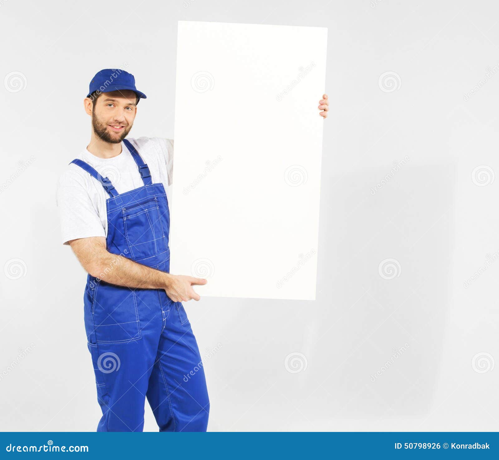 Handsome builder with white board. Handsome young builder with white board