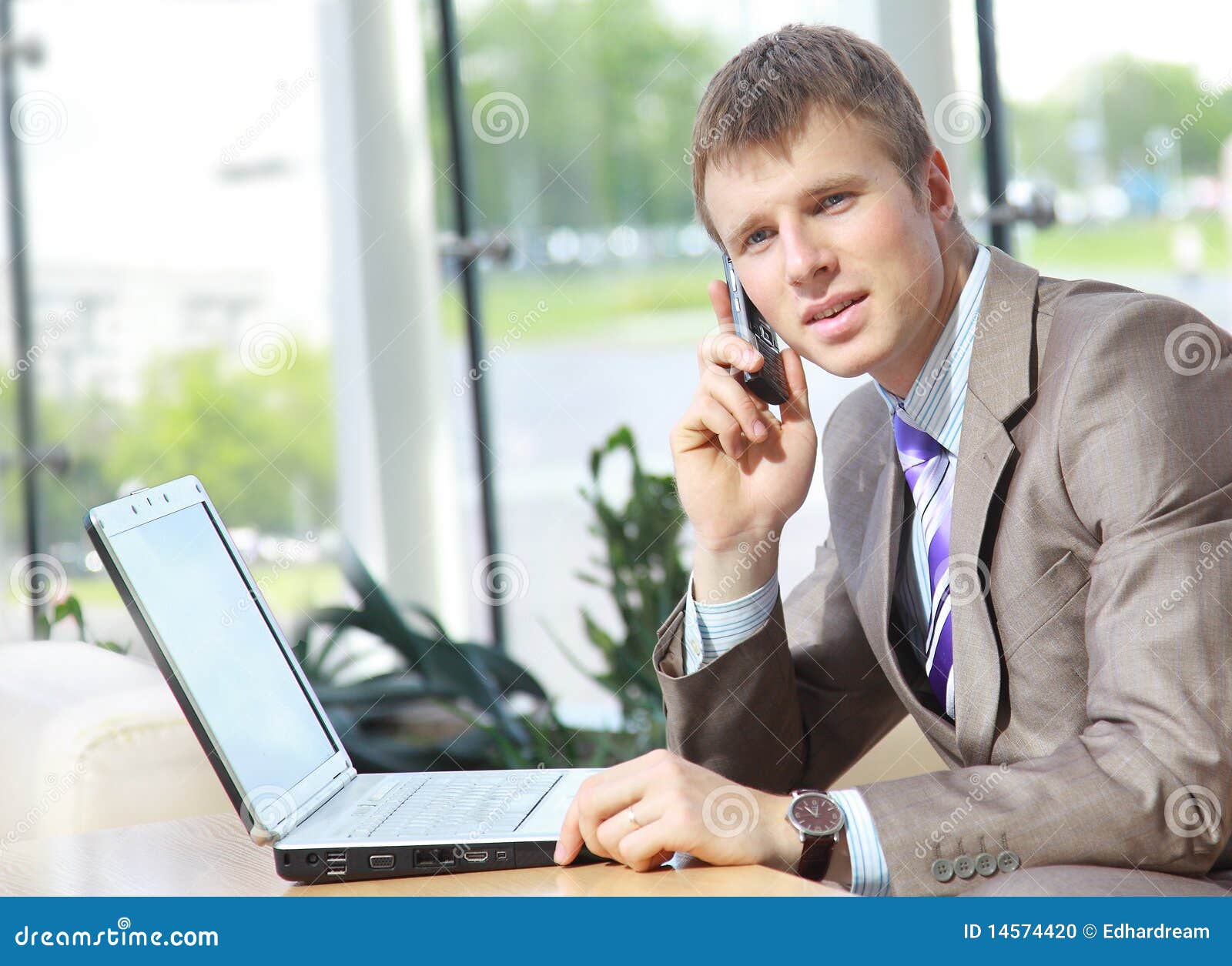 Handsome Business Guy Working on Cellphone and Lap Stock Photo - Image ...