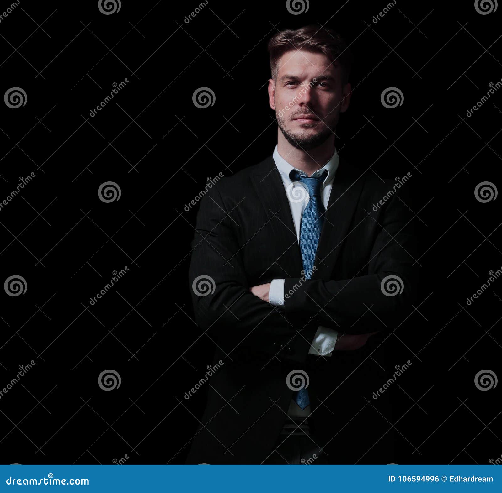 Handsome Business Man Isolated on Black with Arms Crossed Stock Photo ...