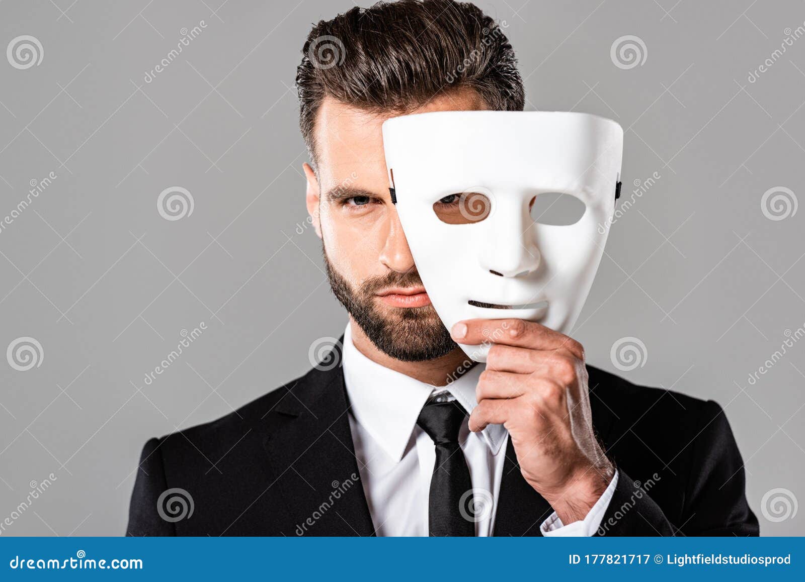 Handsome Businessman in Black Suit Taking Off White Mask Isolated on Grey Stock - Image of success: 177821717