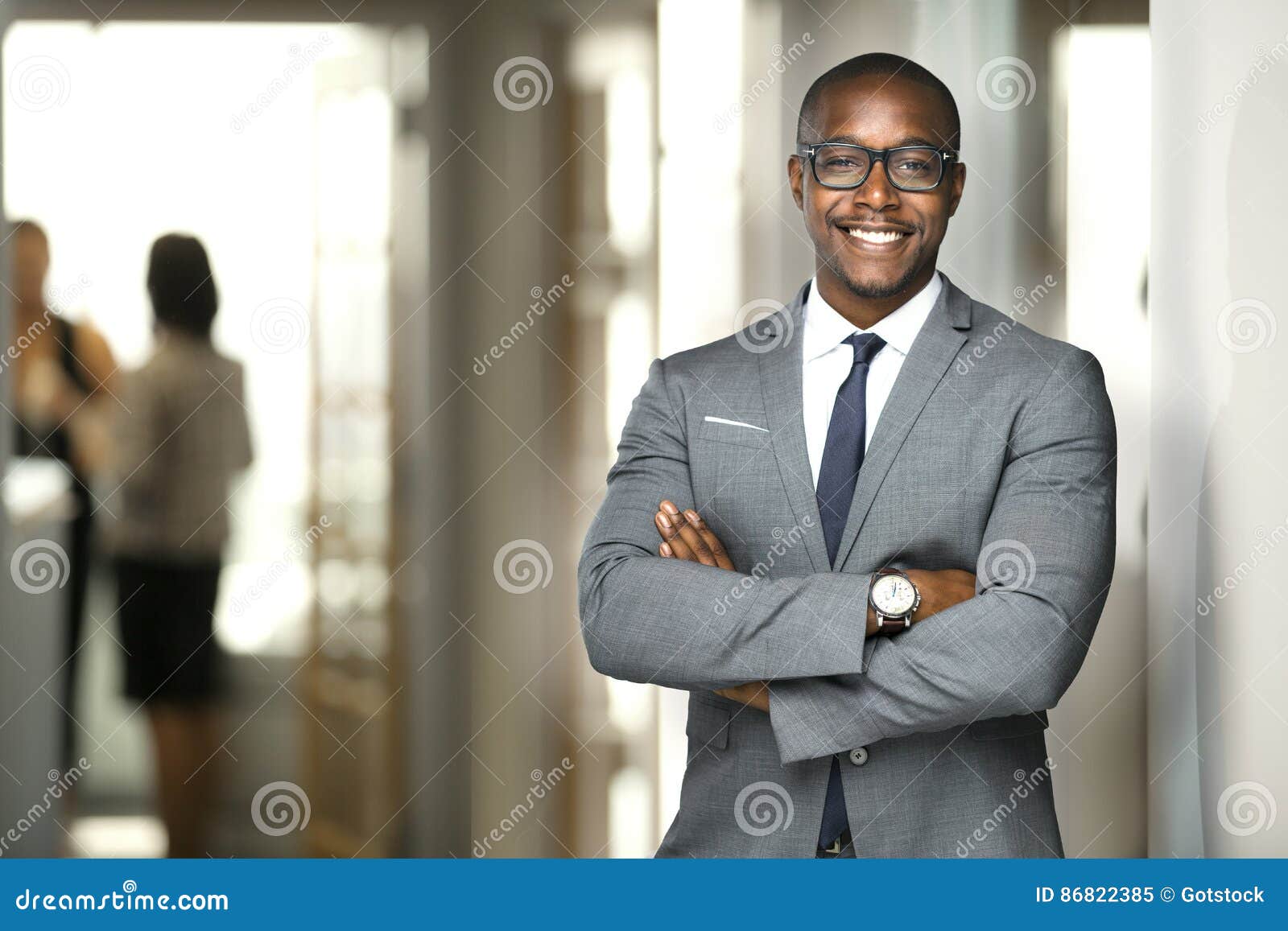 handsome cheerful african american executive business man at the workspace office