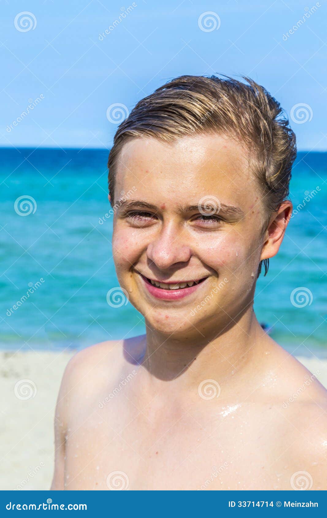 Handsome Confident Teenager at the Beach with Wet Hair after Swimming ...