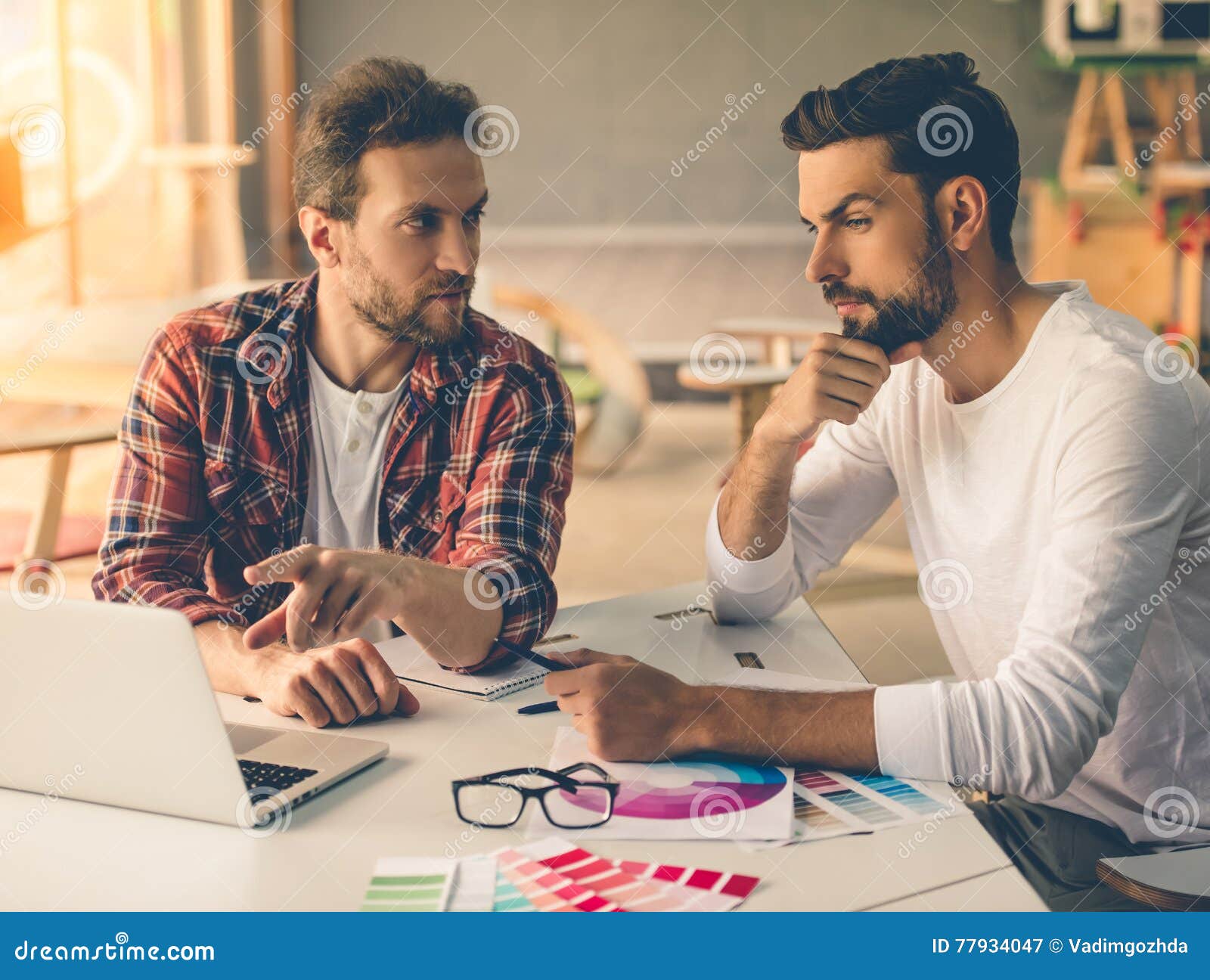 Handsome designers working stock image. Image of blueprint - 77934047