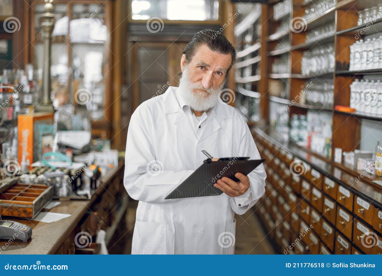 Handsome Eldery Bearded Man Professional Pharmacist, Wearing White Lab ...