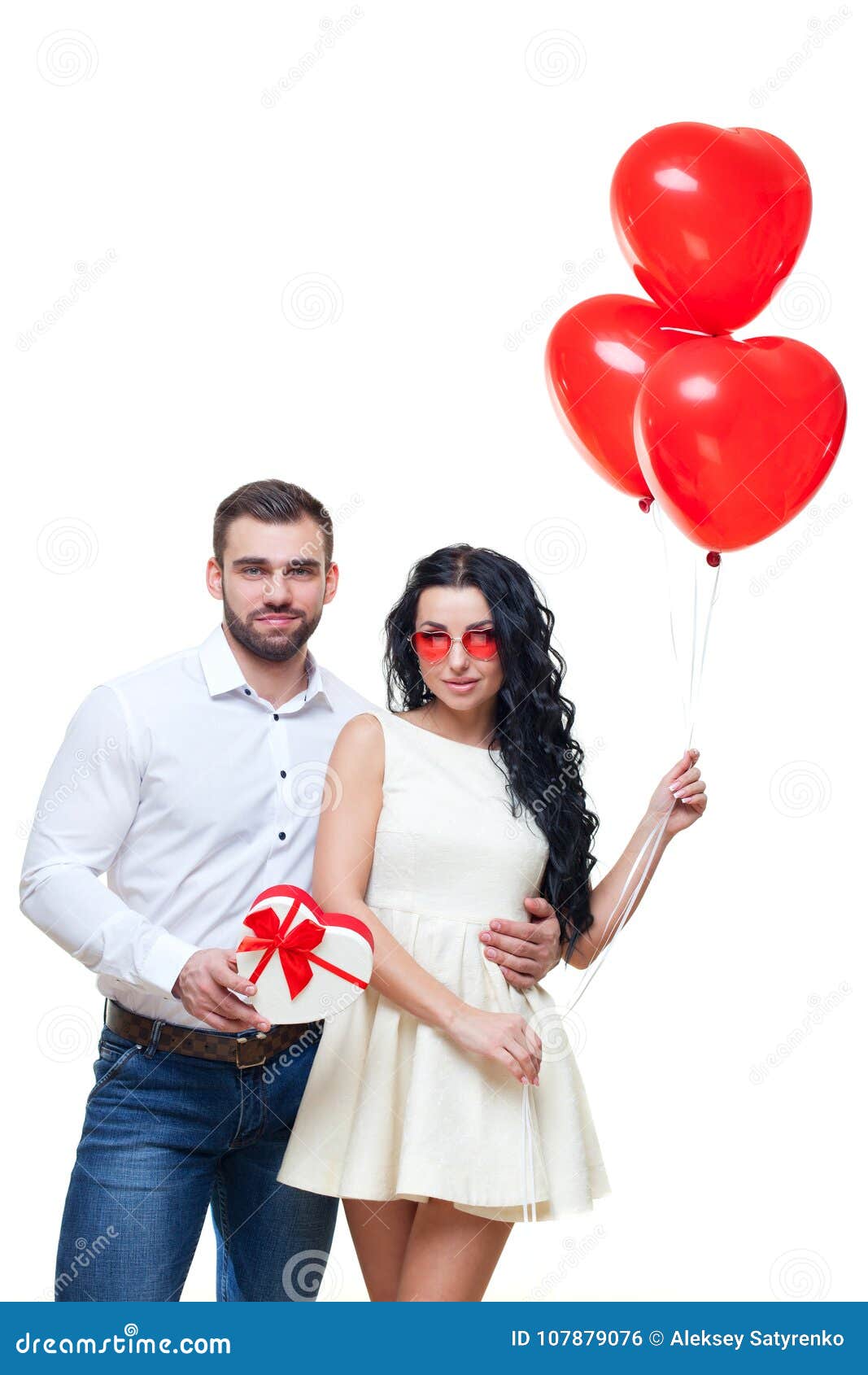 Handsome Elegant Guy Is Presenting A Heart Shaped T And Balloons To His Beautiful Girlfriend
