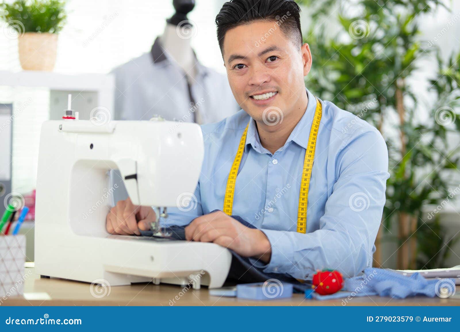 Handsome Fashion Designer Sewing with Sewing Machine Stock Image ...