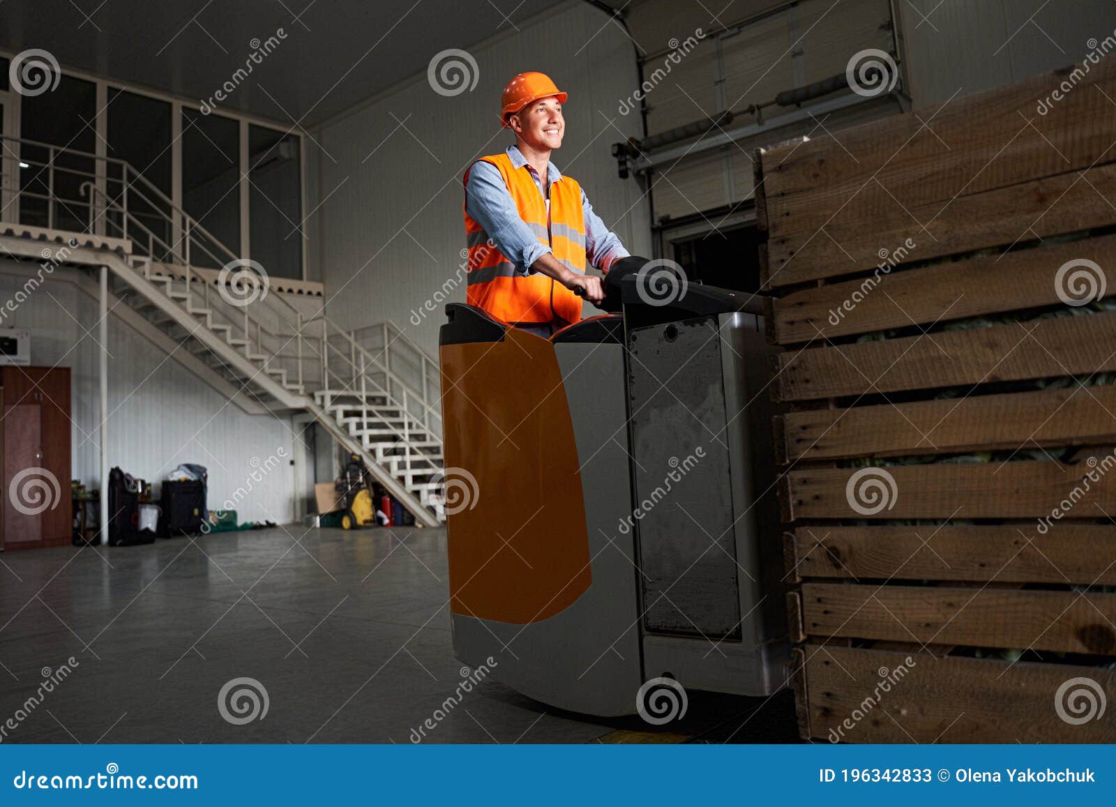 handsome forklift driver at warehouse