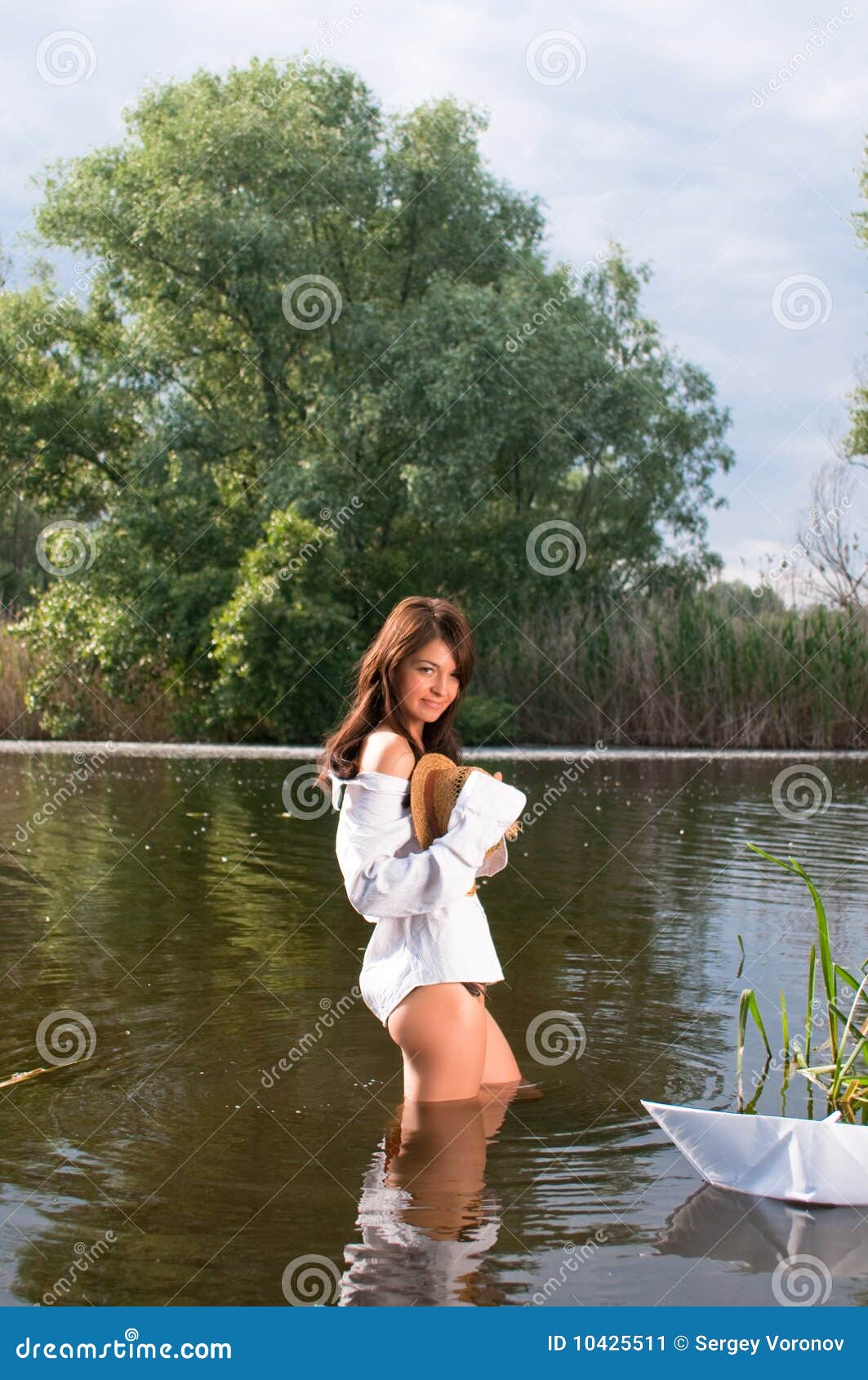 handsome girl in river stock image. image of green