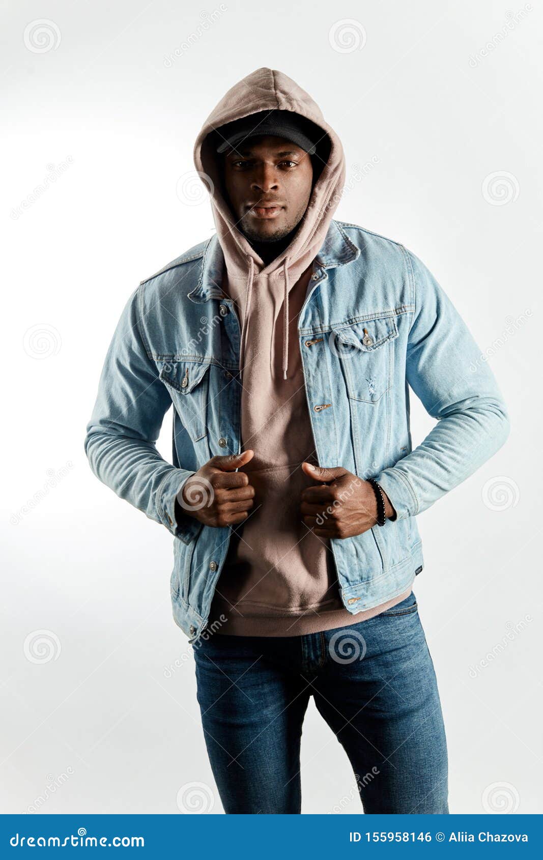 Handsome Guy in Cap and Hood Touching His Jacket and Posing To the ...