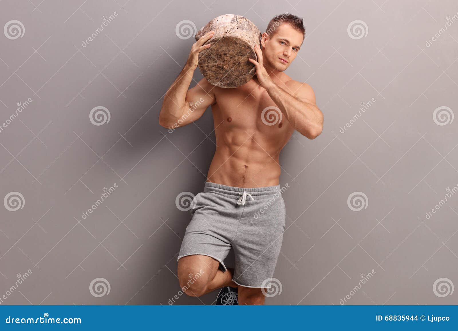 Handsome Guy Carrying A Log On His Shoulder Stock Photo Imag