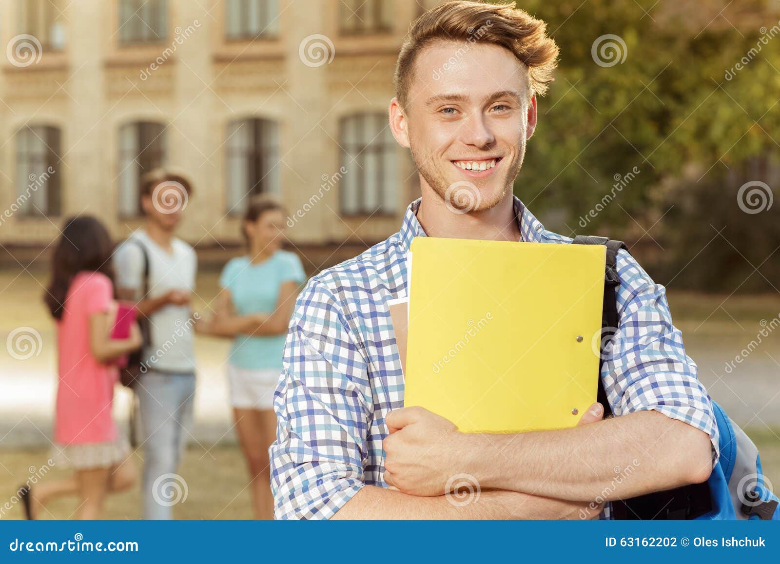 Handsome Guy Holding a Notebook Stock Photo Image of friendship