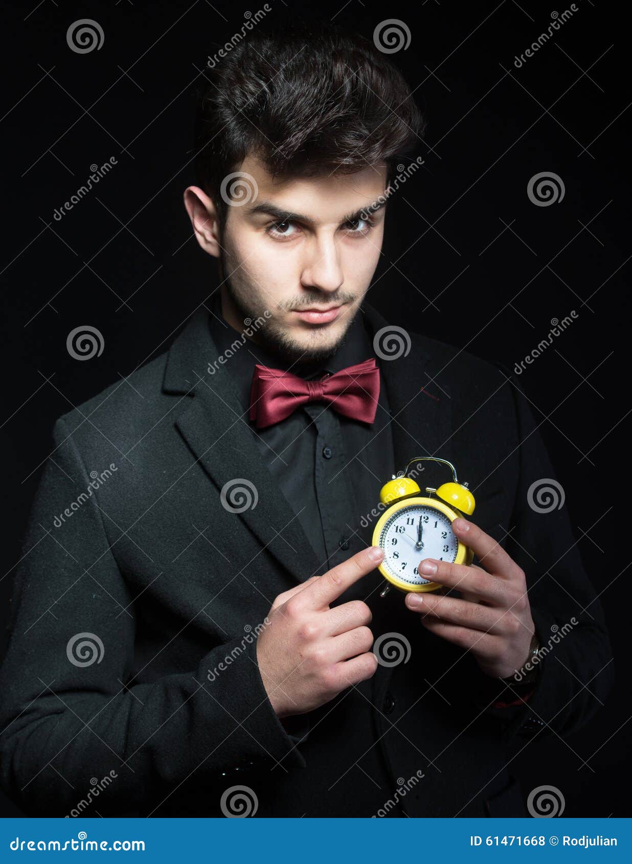 Handsome Guy with a Yellow Alarm Clock Stock Photo Image of handsome