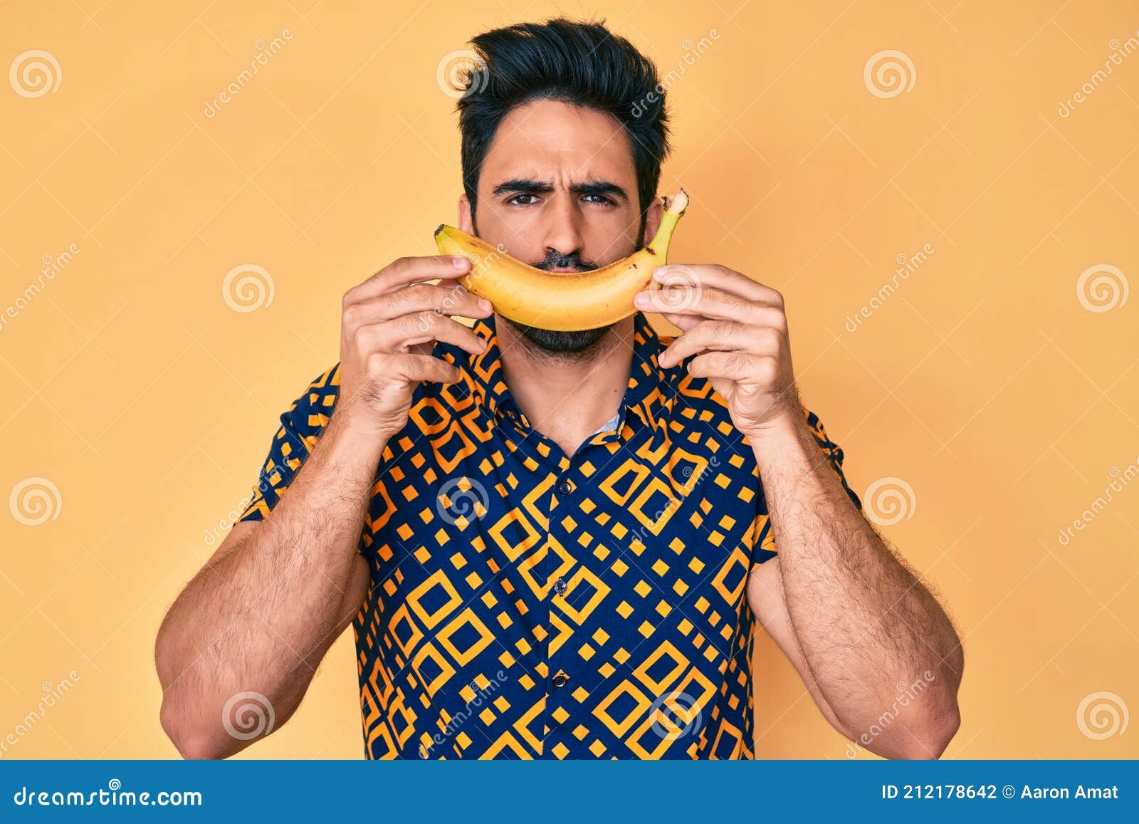 Handsome Hispanic Man with Beard Holding Banana Like Funny Smile Looking at the Camera Blowing a Kiss Being Lovely and Stock Photo - Image of latino, cheerful: 212178642 Handsome Hispanic Man with Beard Holding Banana Like Funny Smile Looking at the Camera Blowing a Kiss Being Lovely and Stock Photo - Image of latino, cheerful: 212178642