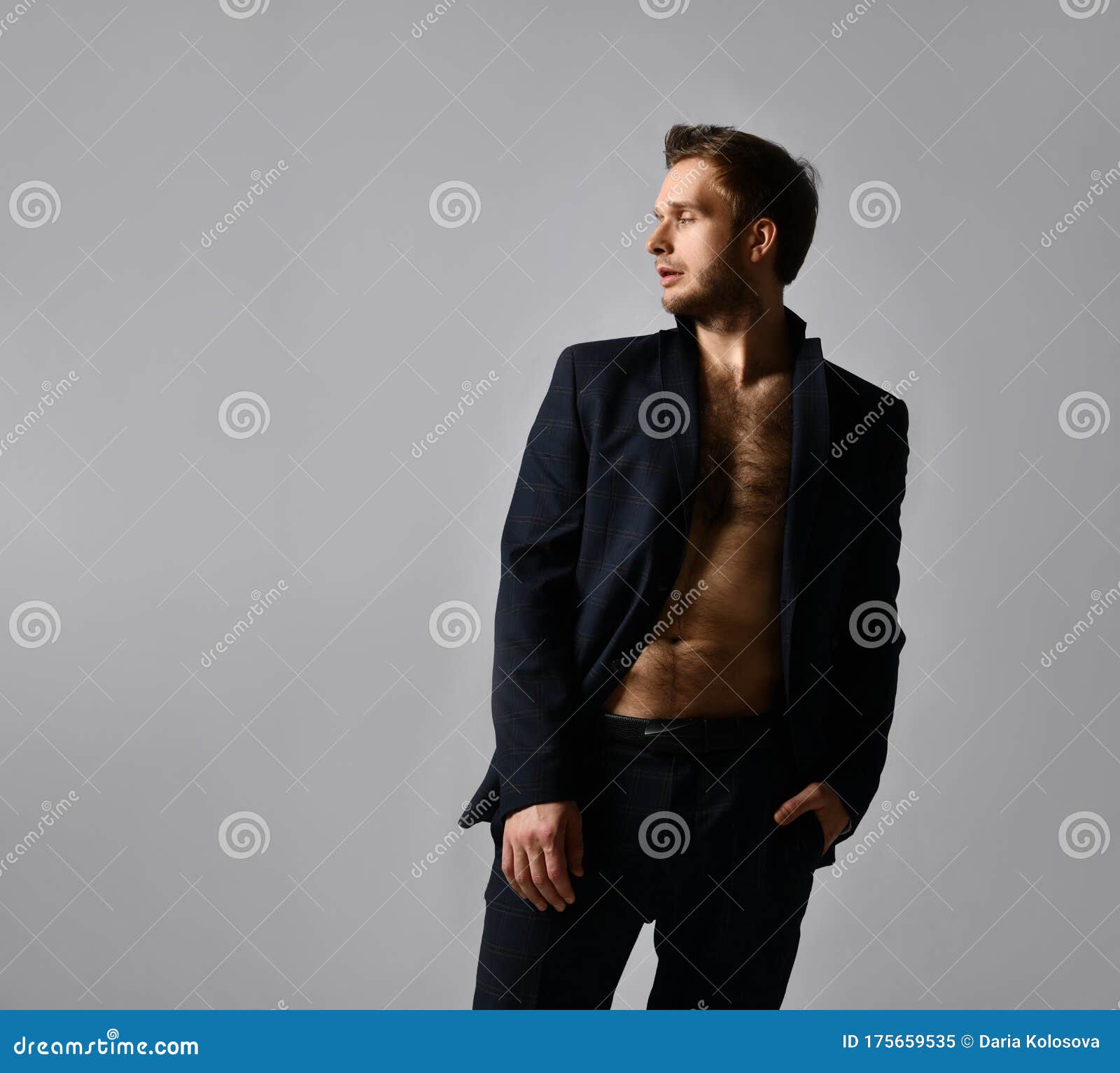 Handsome Man in Black Classic Suit on Naked Body. he is Straightening His  Jacket, Posing Against Gray Background. Close Up Stock Image - Image of  body, gray: 175659535