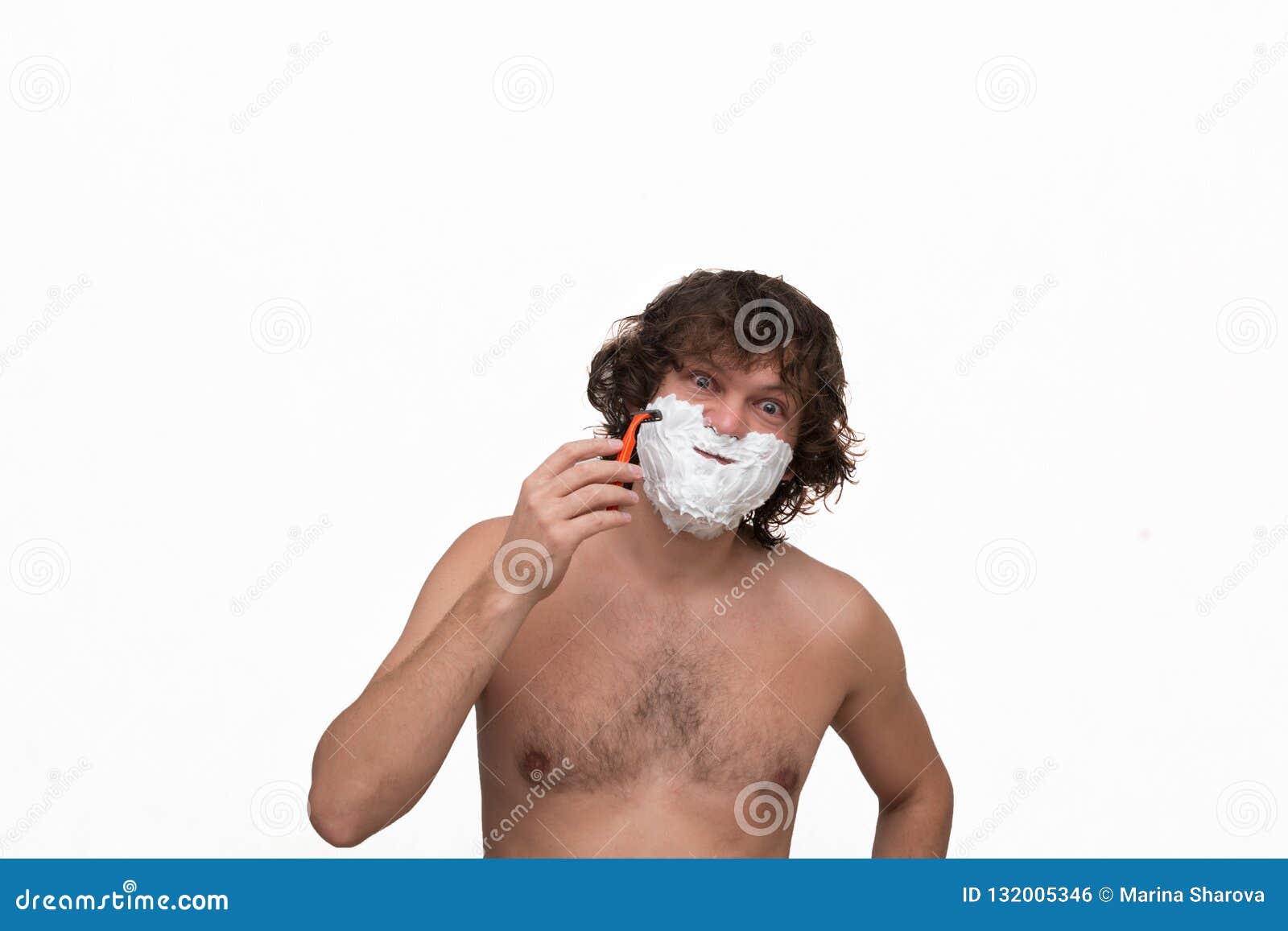 Handsome Man with Dark Wet Curly Hair Shaving His Beard with a Razor  Isolated on White. Close Up Portrait of a Man Distorts the Stock Photo -  Image of body, male: 132005346