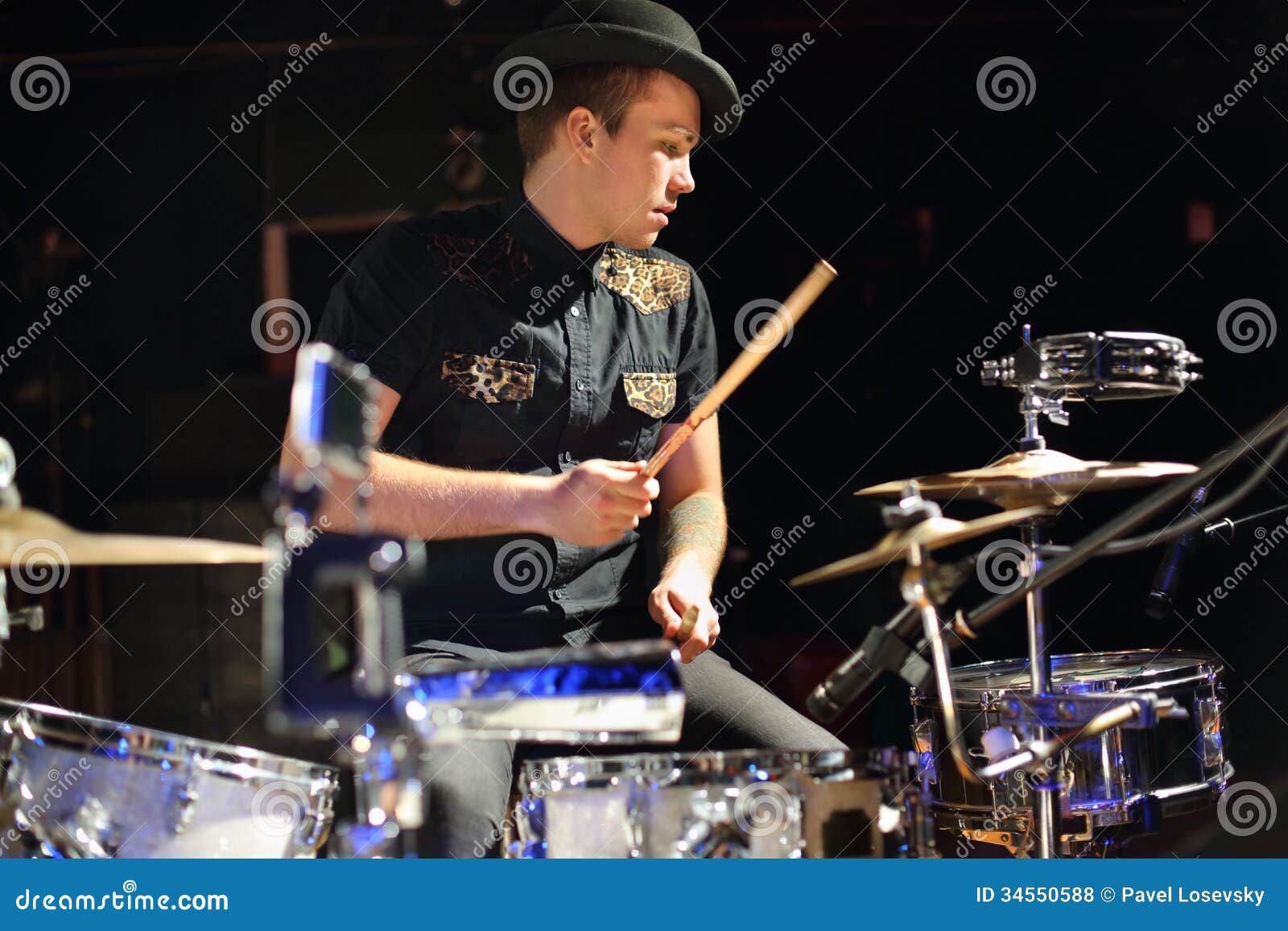 Handsome Man in Hat and Black Shirt Plays Drum Set Stock Photo - Image ...