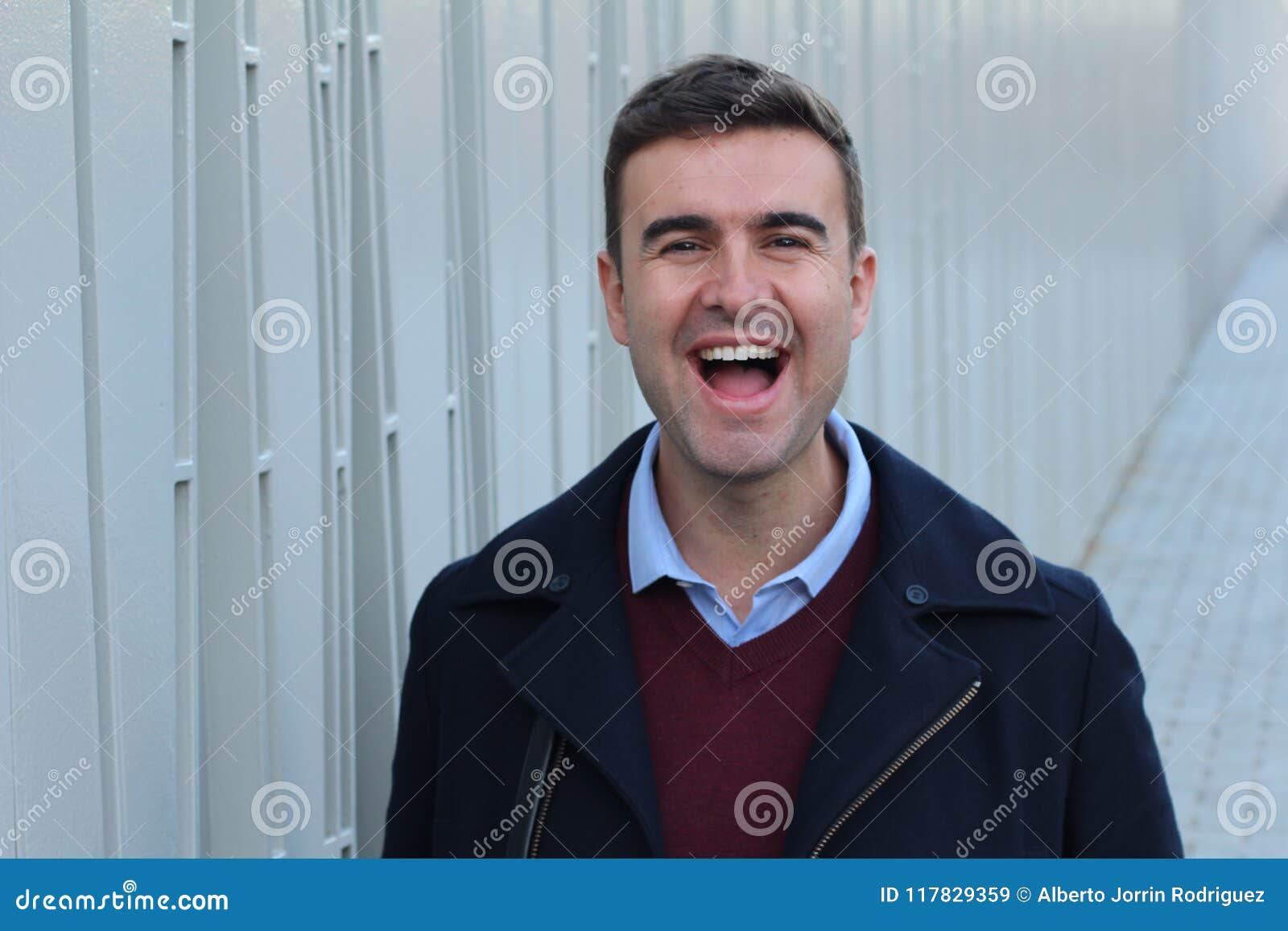 Handsome man laughing out loud.