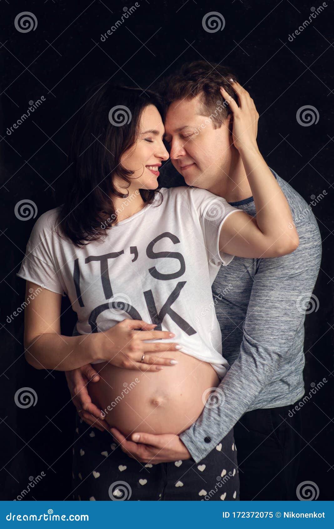 Handsome Man Is Listening To His Beautiful Pregnant Wife`s Tummy And Smiling Stock Image Image