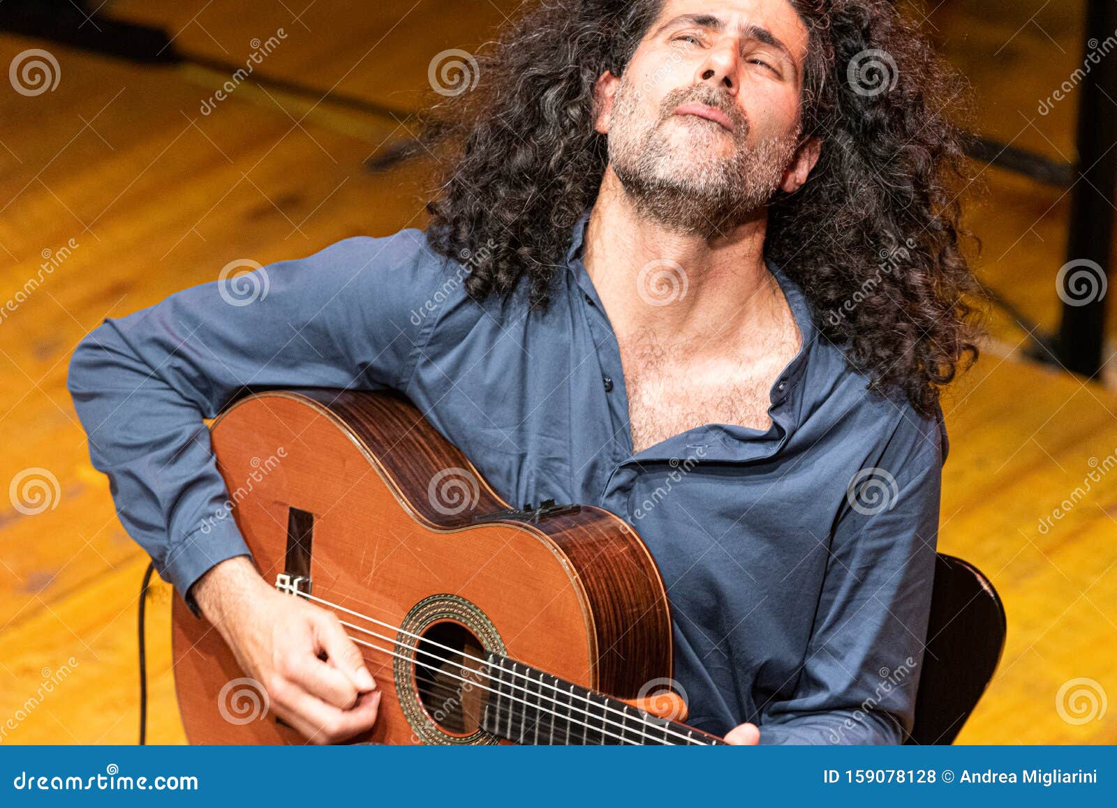 Handsome Man with Long Hair Playing Classical Guitar Stock Photo - Image of  player, stage: 159078128