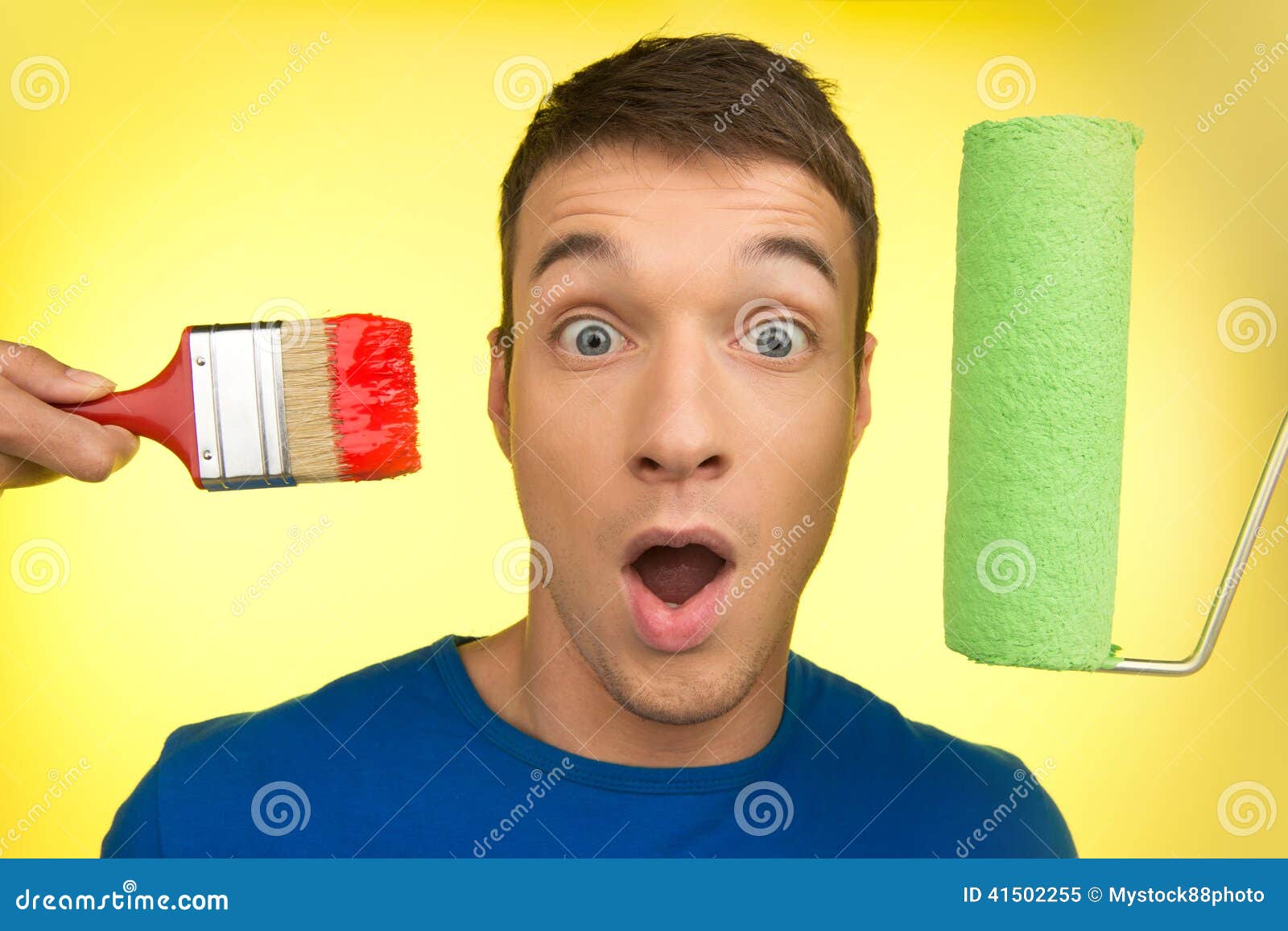 Handsome Man with Paint Brush and Roller. Stock Image Image of craft