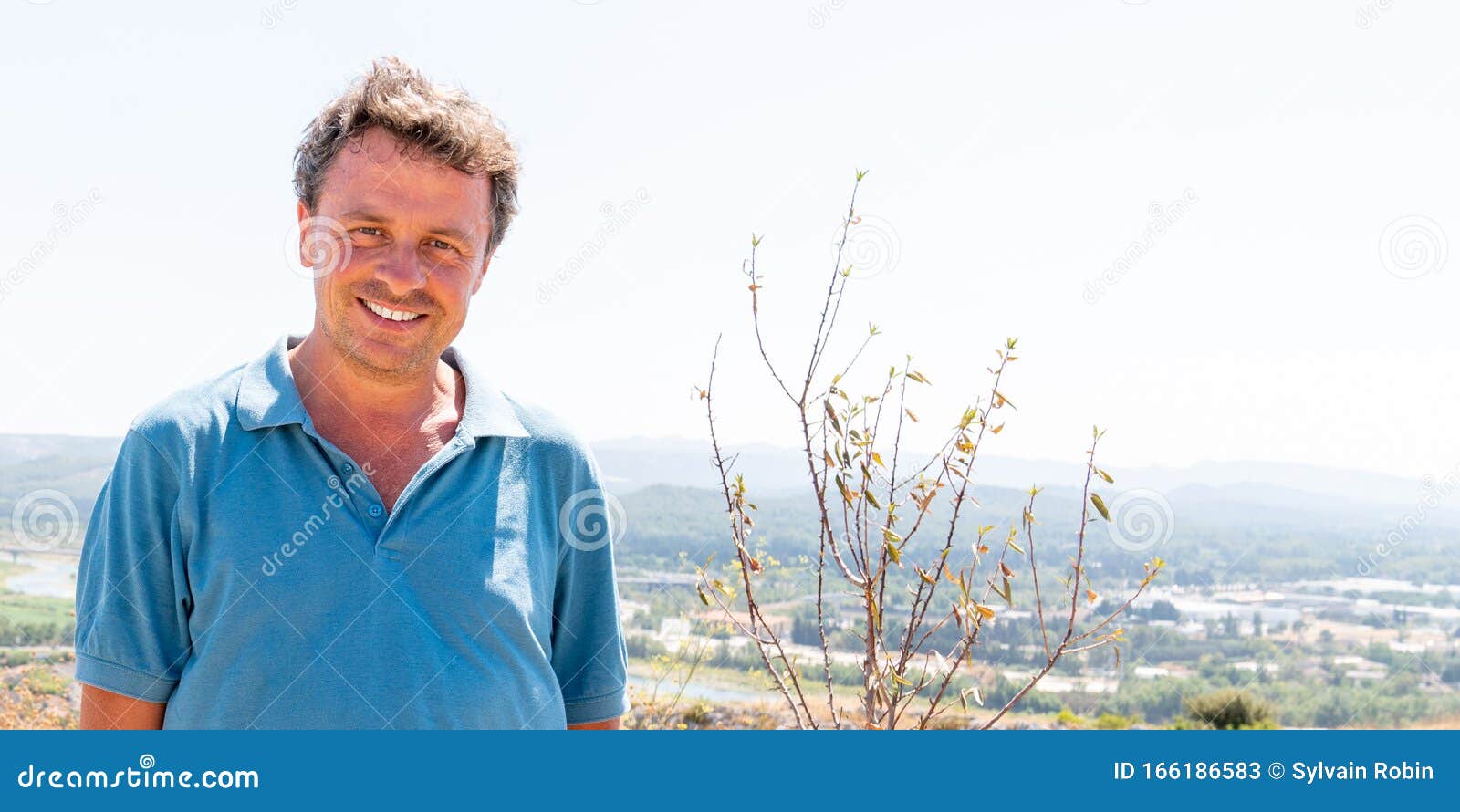 handsome man in panoramic view background city cavaillon in provence on web banner header