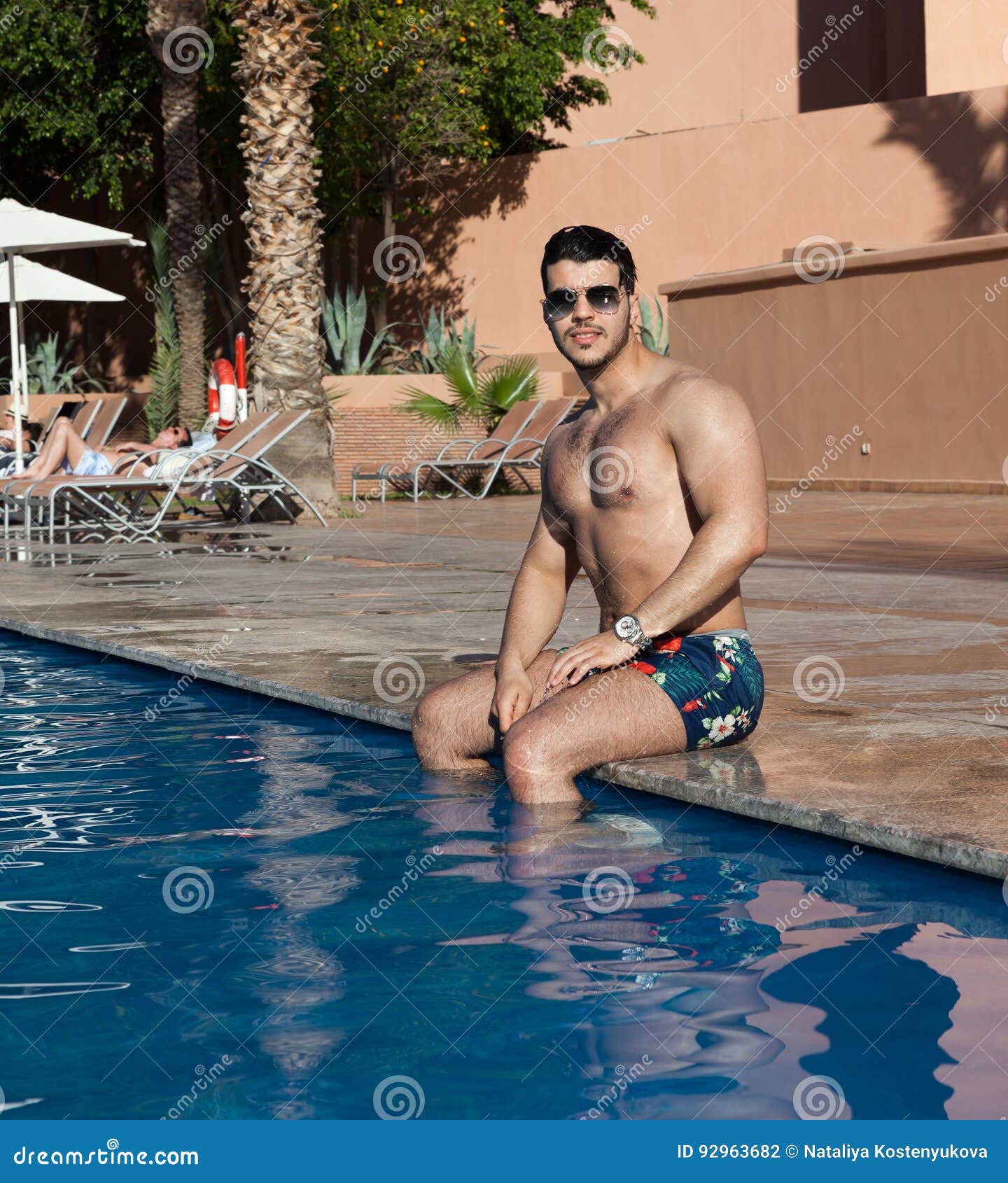 Handsome man in pool stock photo. Image of vacation, relax 92963682