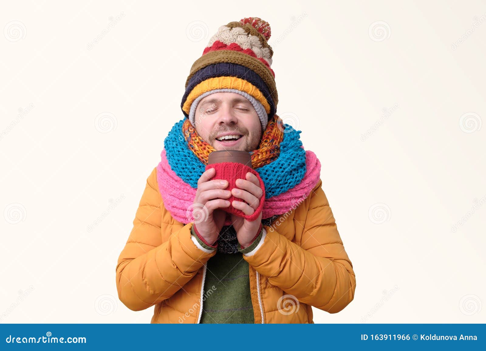 Handsome Man in Several Winter Hat and Scarf Drinking Coffee. Stock ...