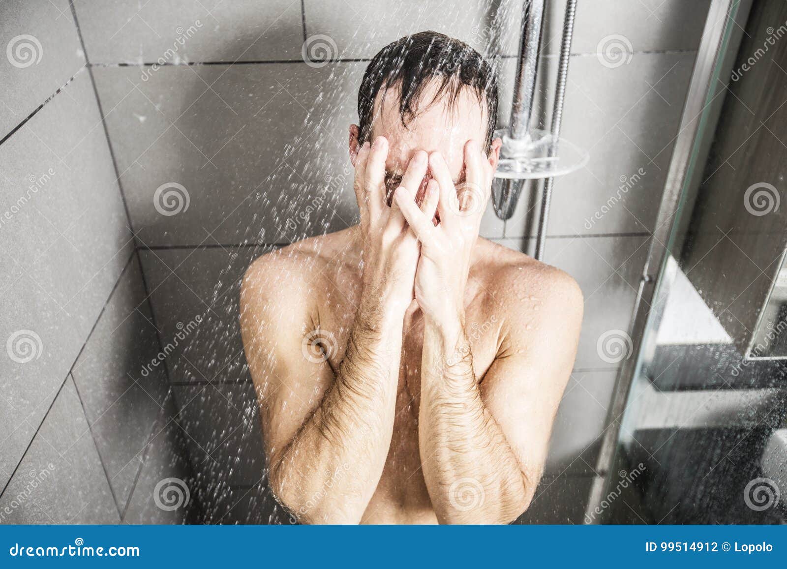 Handsome man in shower stock photo.