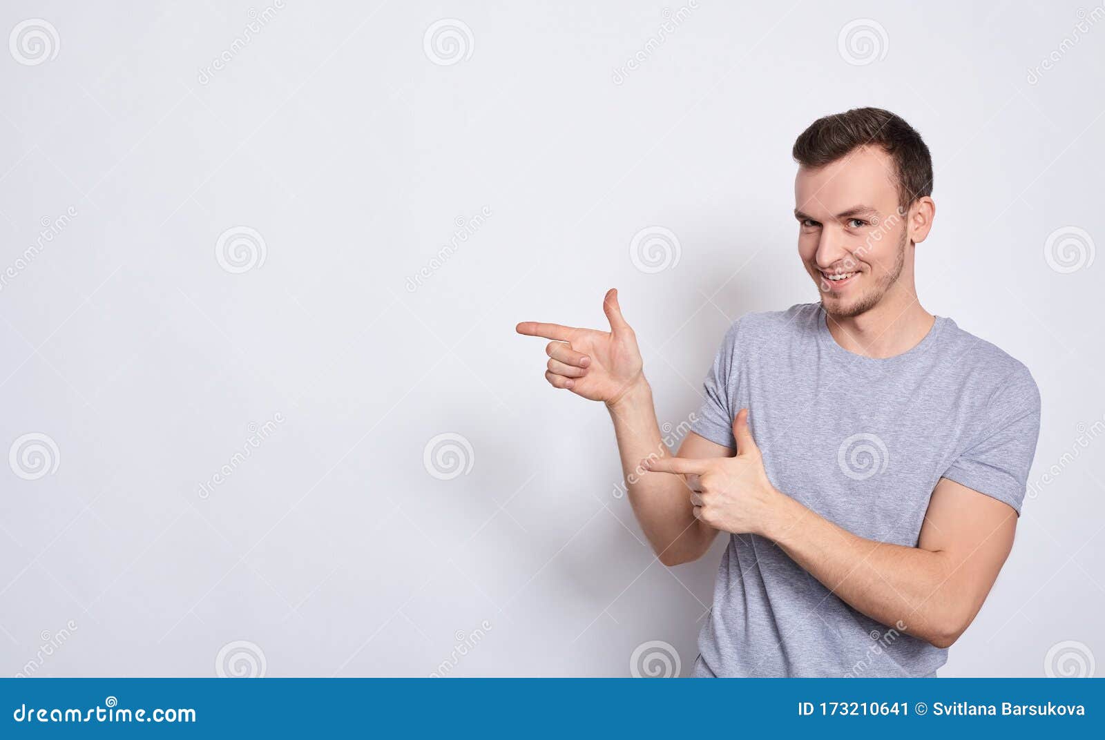 A Handsome Man Shows His Fingers To the Left Stock Image - Image of ...