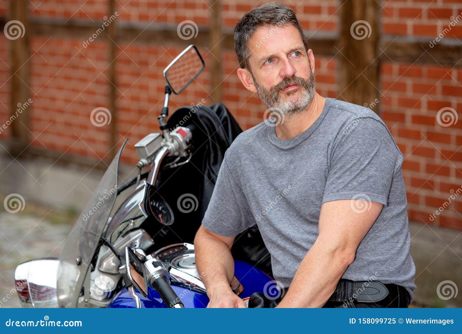 Handsome Man Sitting on His Bike Outdoors Stock Image - Image of ...
