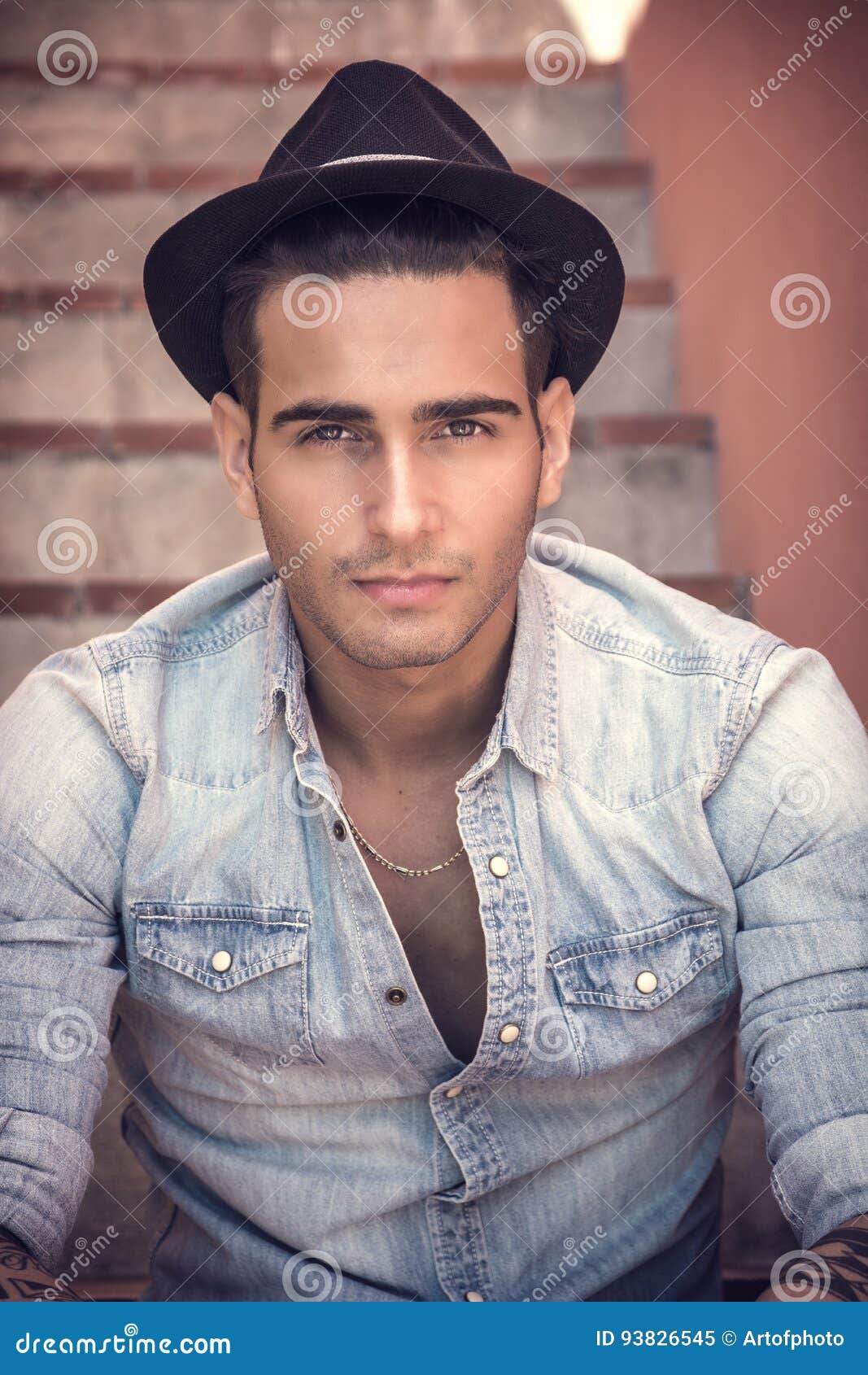 Handsome Man Sitting on Stairs while Looking at Camera Stock Image ...