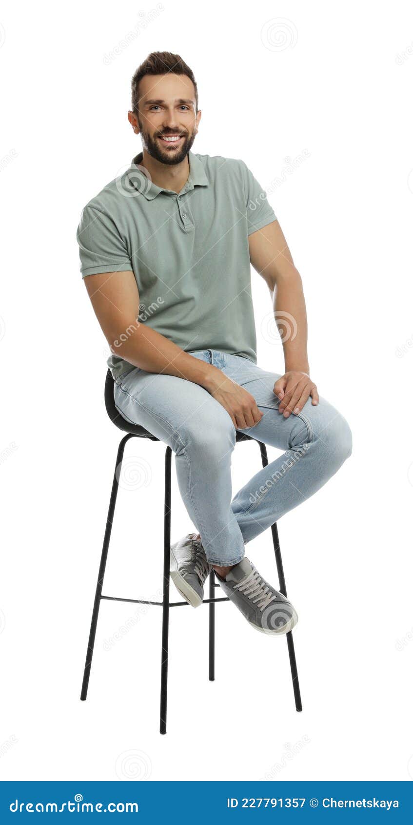 Handsome Man Sitting on Stool Against White Background Stock Image ...