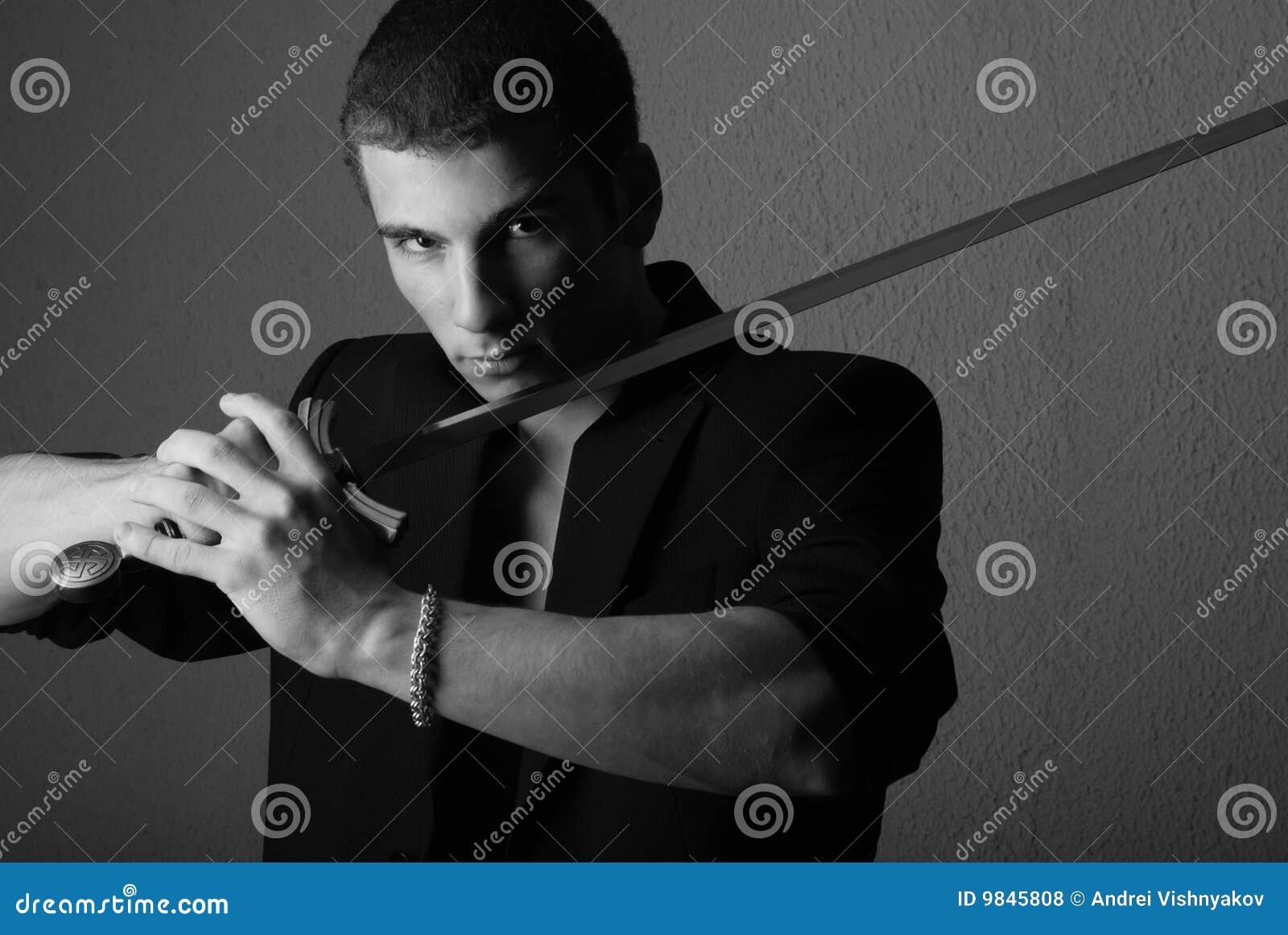Handsome man with sword stock photo. Image of staring - 9845808