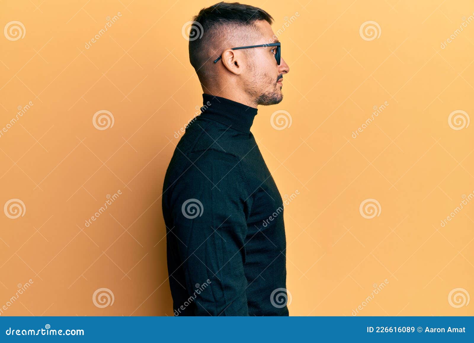 A man with a goatee and a turtle neck sweater photo – Man face