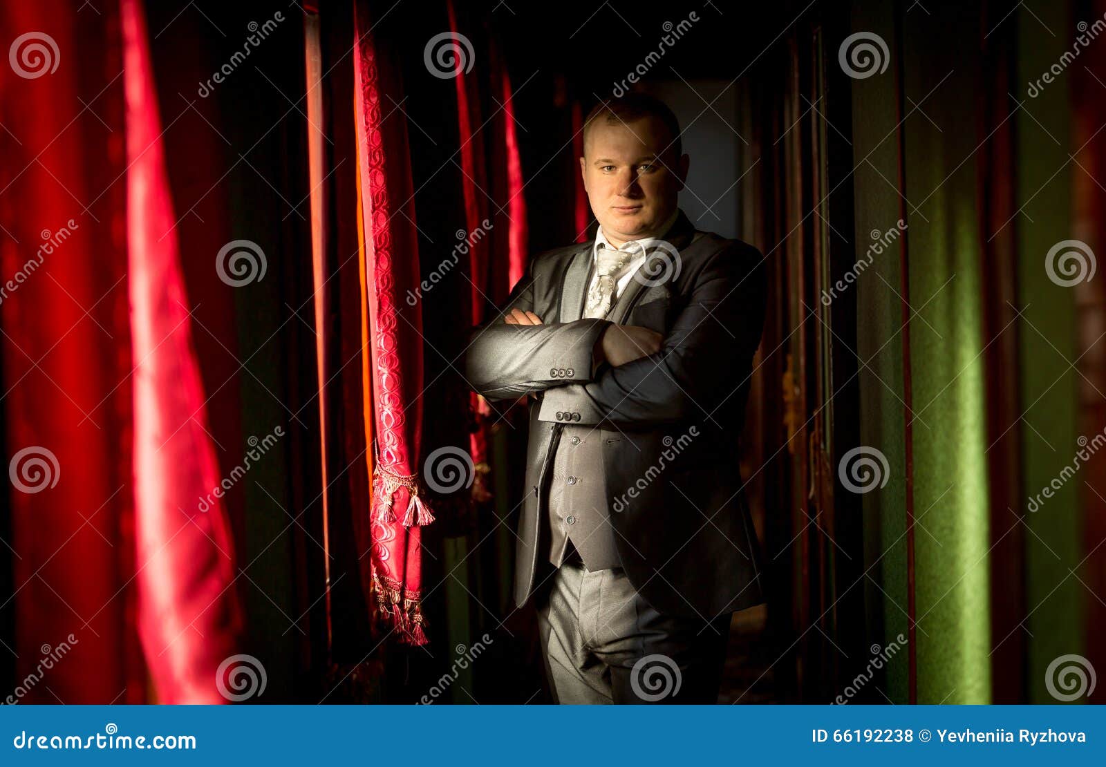 Handsome Man in Vintage Suit Posing in Train Corridor Stock Photo