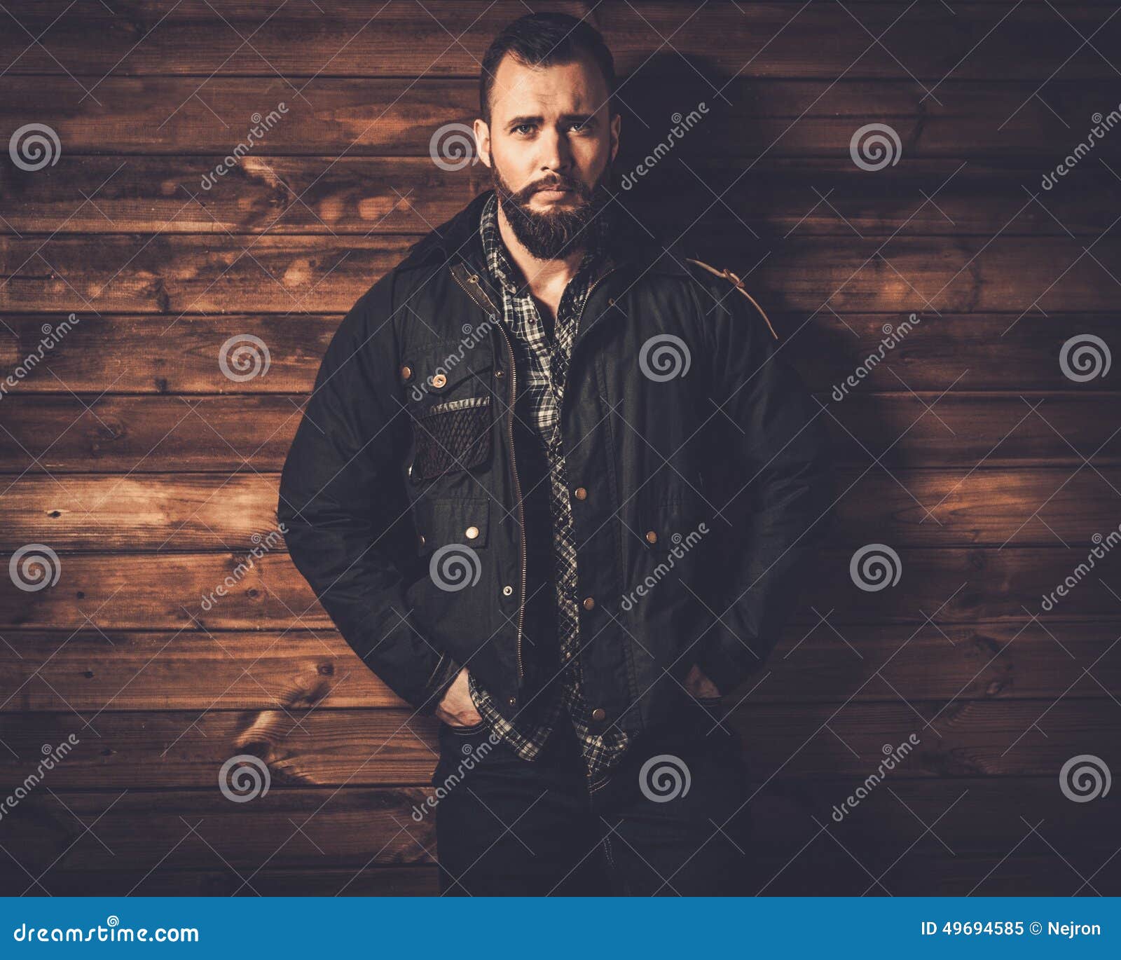handsome man wearing waxed canvas jacket