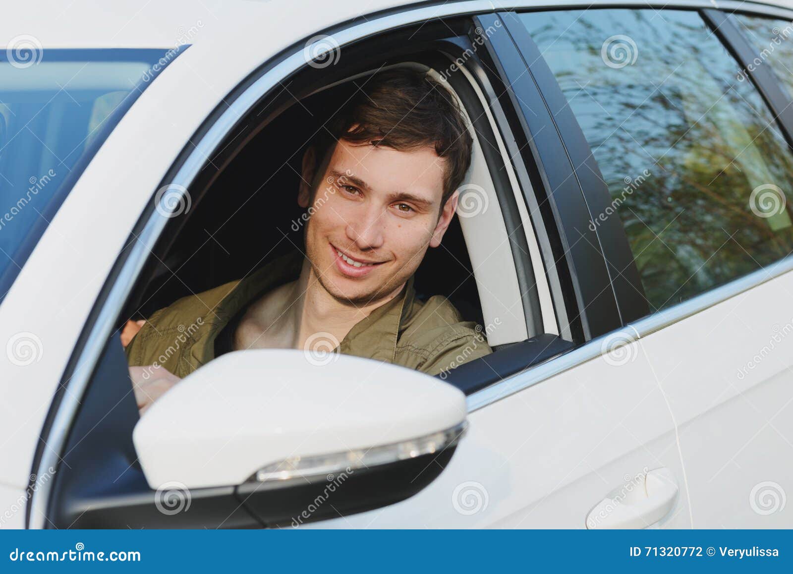 Handsome man in white car stock photo. Image of driver 71320772