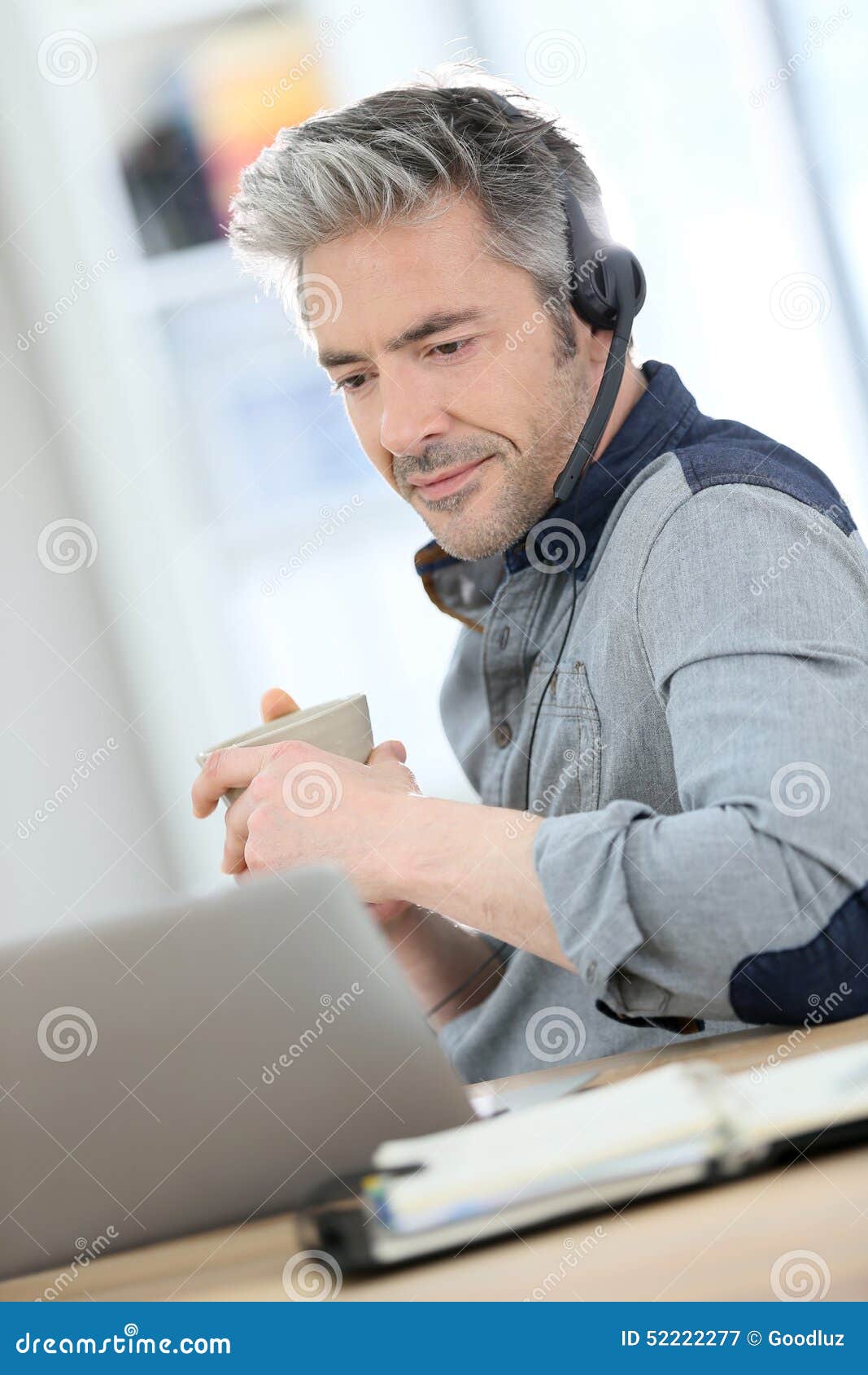 handsome mature man teleworking from home
