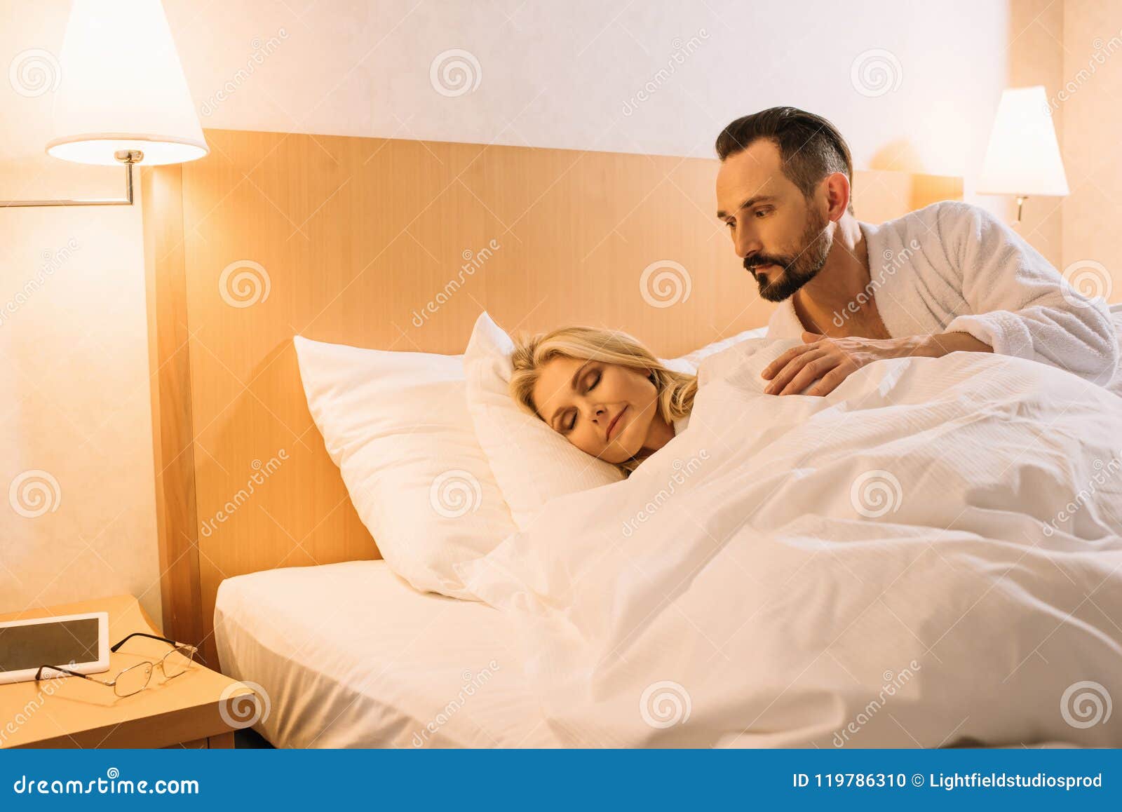 Man Looking His Wife Sleeping Stock Photos